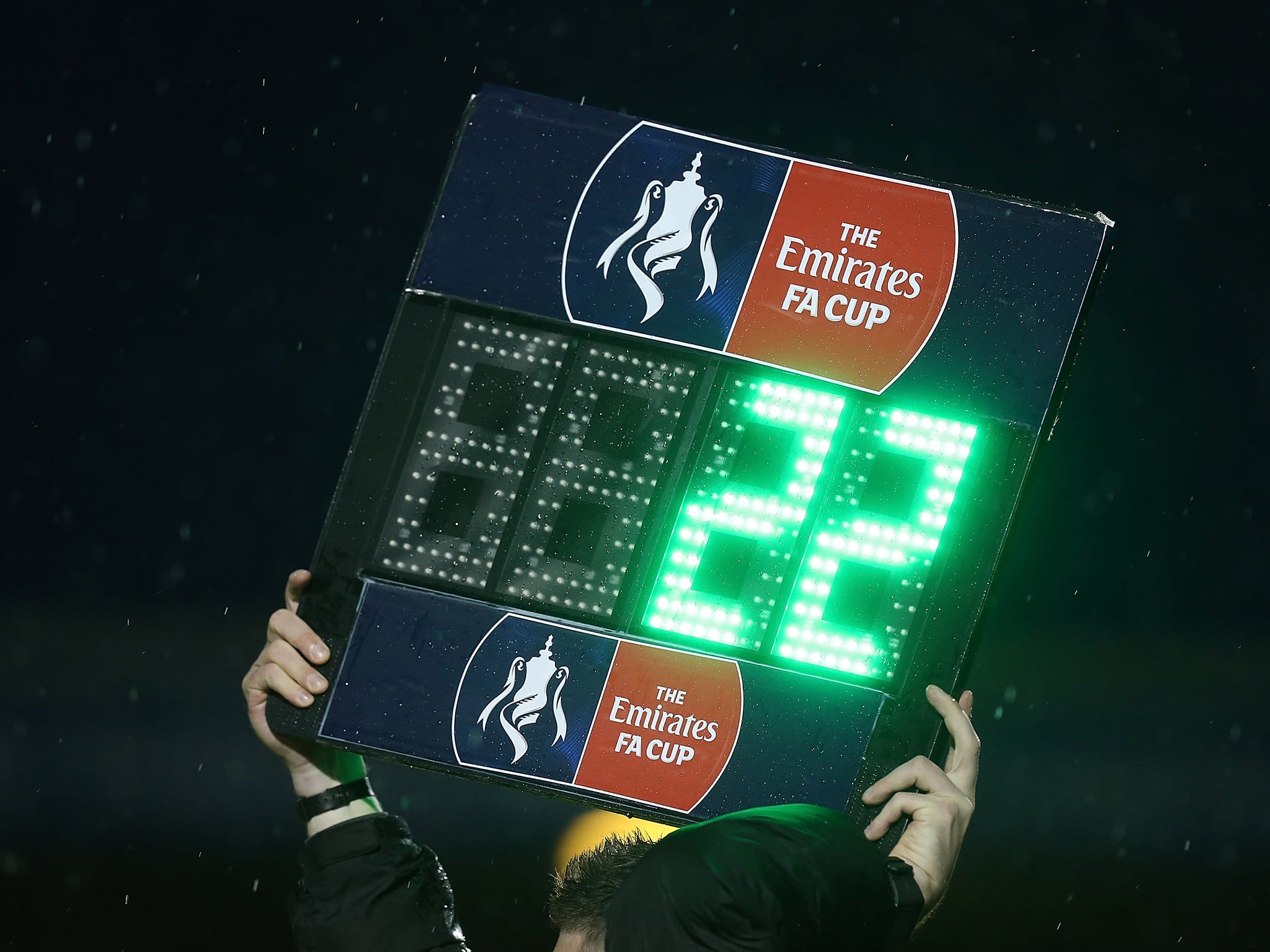 A fourth official displays his substitutes board during last season's FA Cup