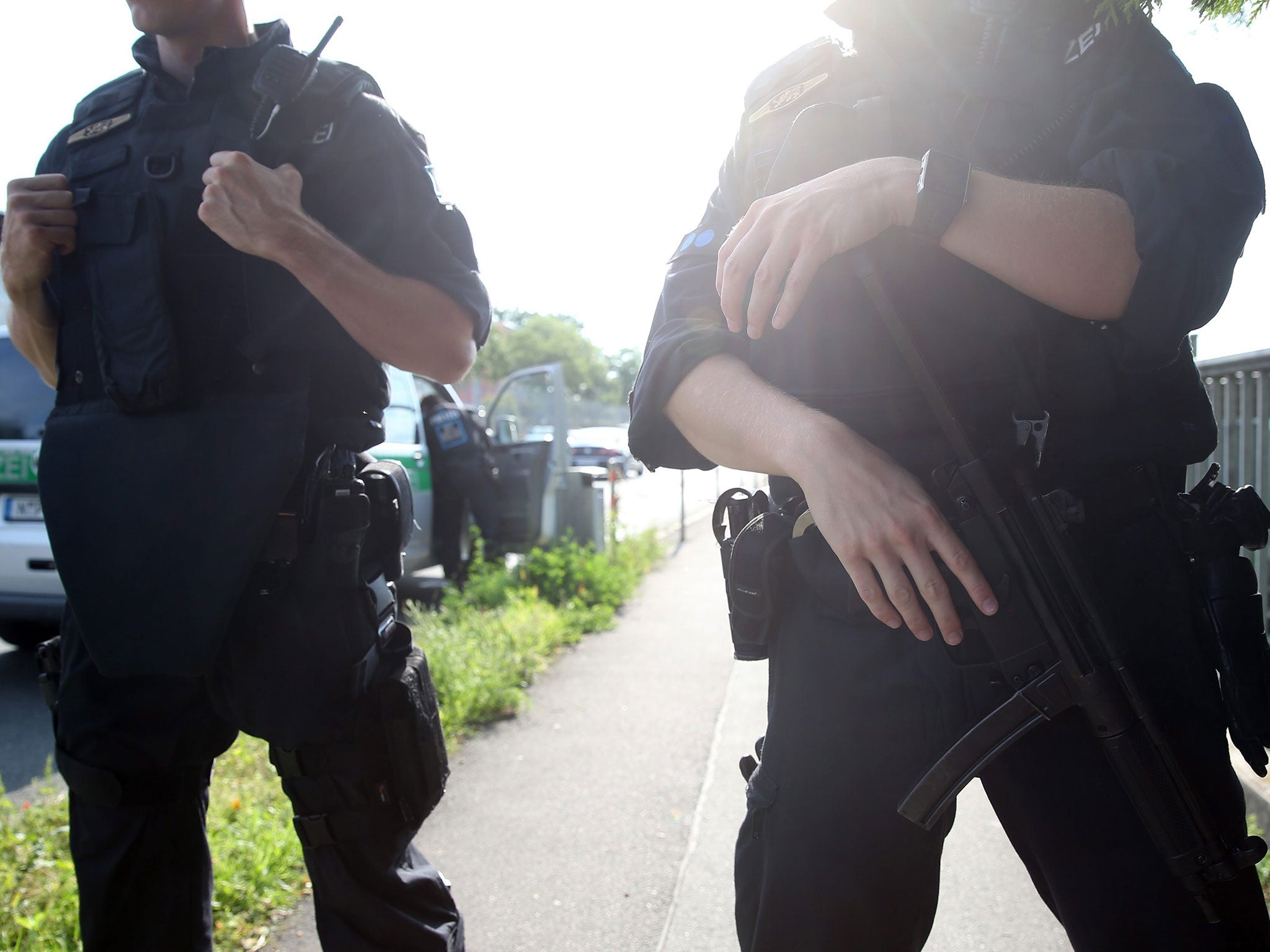 Policemen near the reception centre for refugees in Zirndorf, Germany, 27 July 2016.