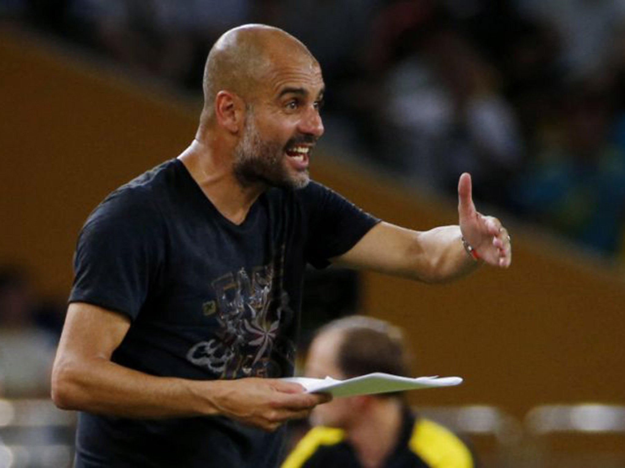 Pep Guardiola bellows out his instructions from the sideline