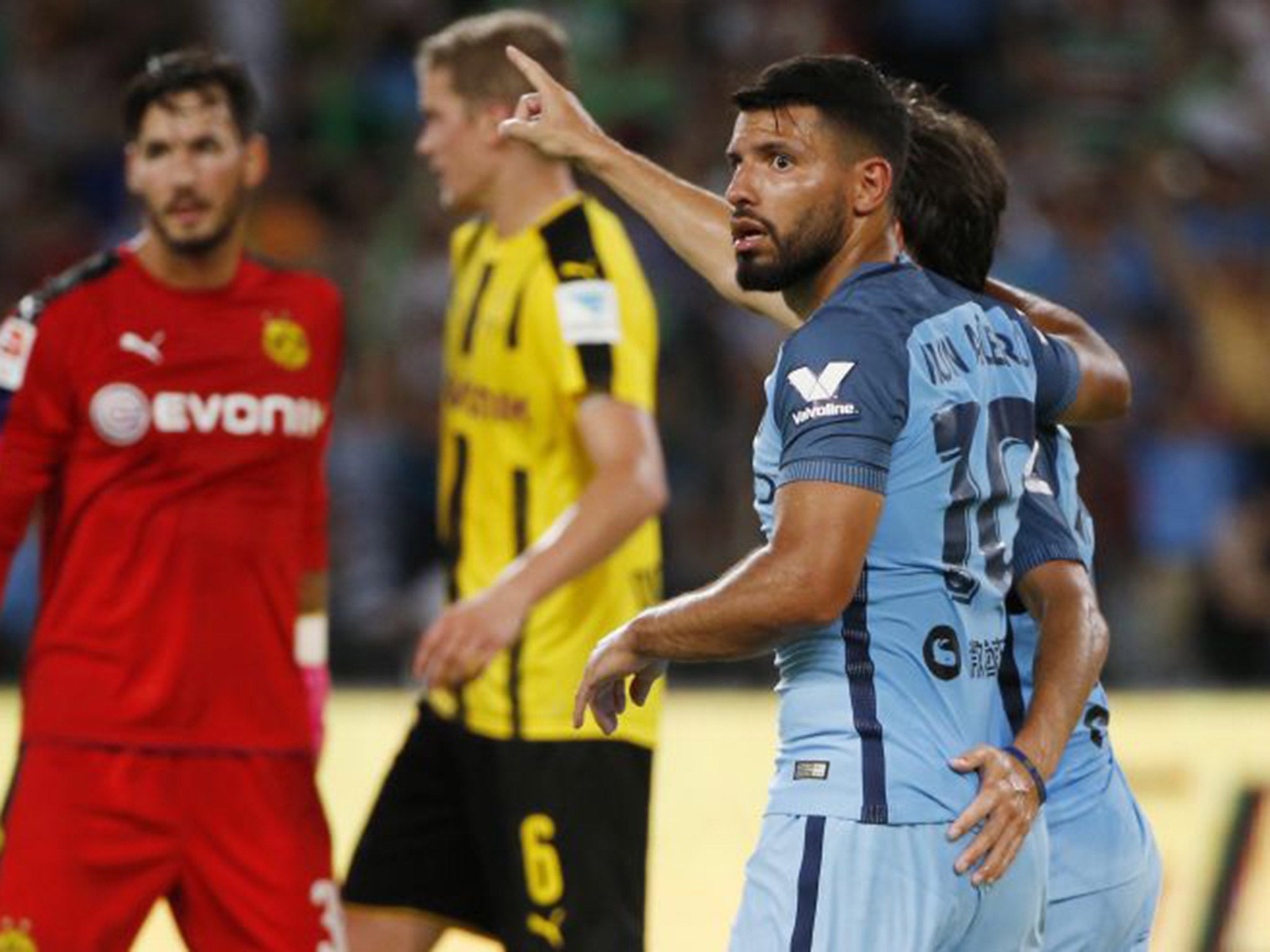 Aguero celebrates his goal alongside Manchester City teammate David Silva