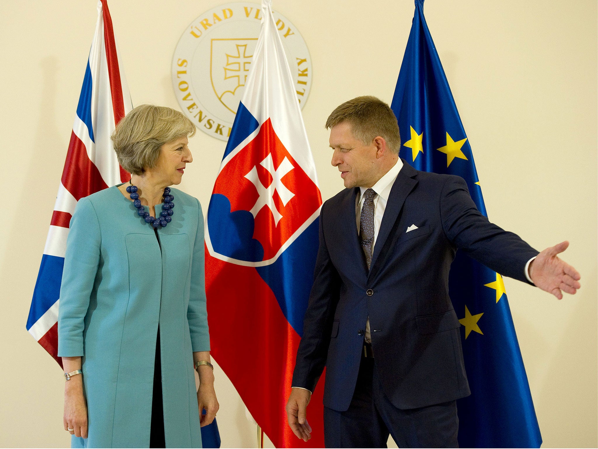 Slovakia’s Prime Minister Robert Fico welcomes British Prime Minister Theresa May prior to their meeting in Bratislava