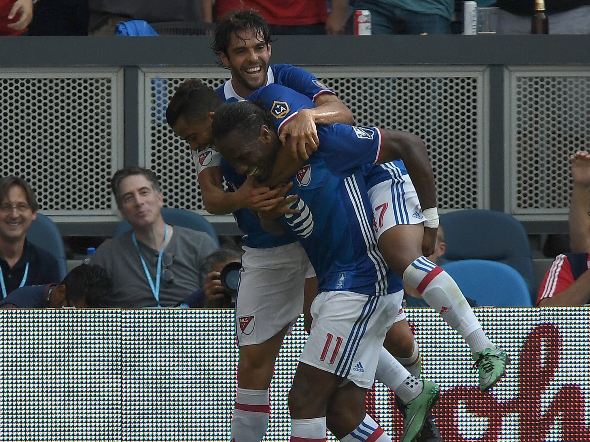 MLS All-Stars players celebrate Didier Drobga's equaliser against Arsenal