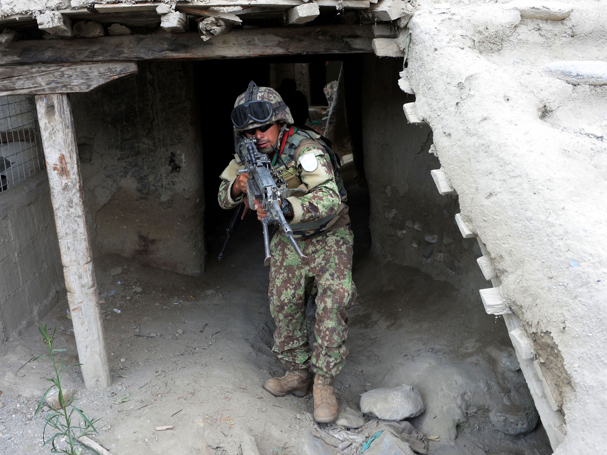 An Afghan security force member takes part in a patrol in Kot District in eastern Nangarhar province