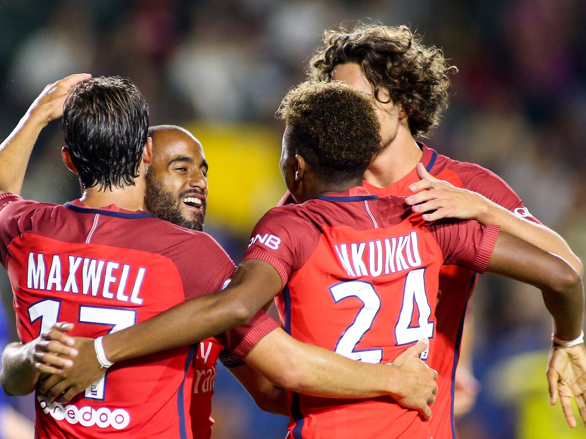 Lucas Moura is joined by his PSG teammates to celebrate scoring the third goal