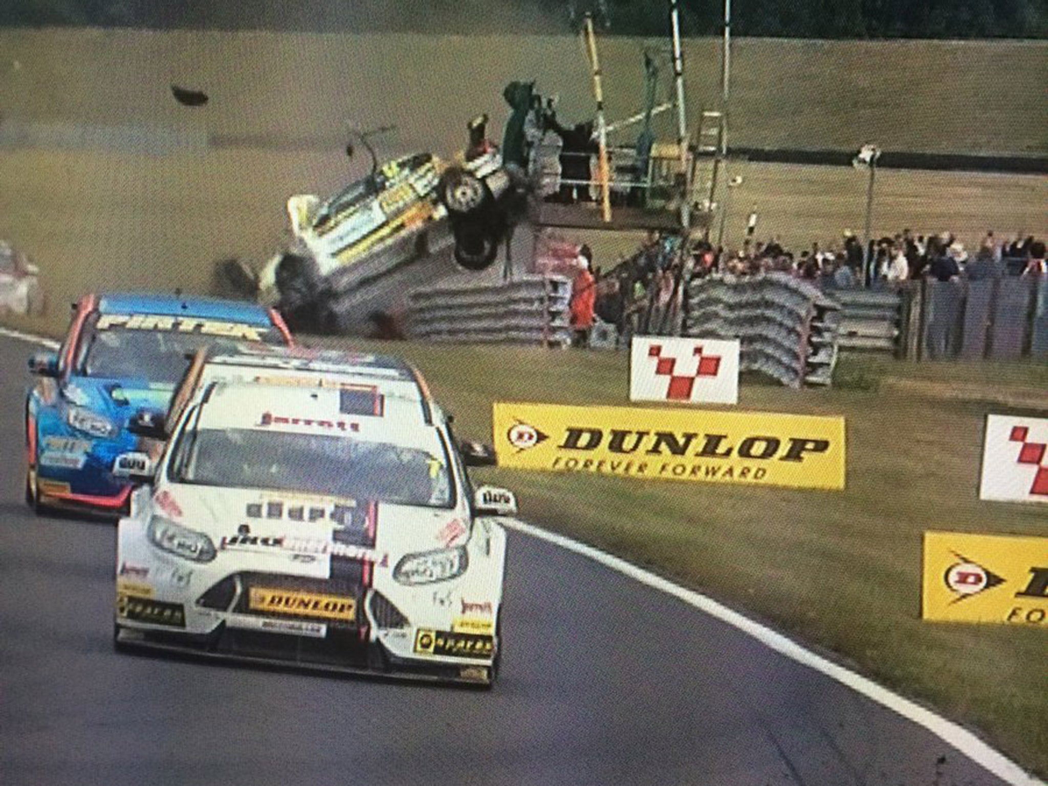 Hunter Abbott's Chevrolet Cruse flips into a TV tower during the BTCC race three at Snetterton