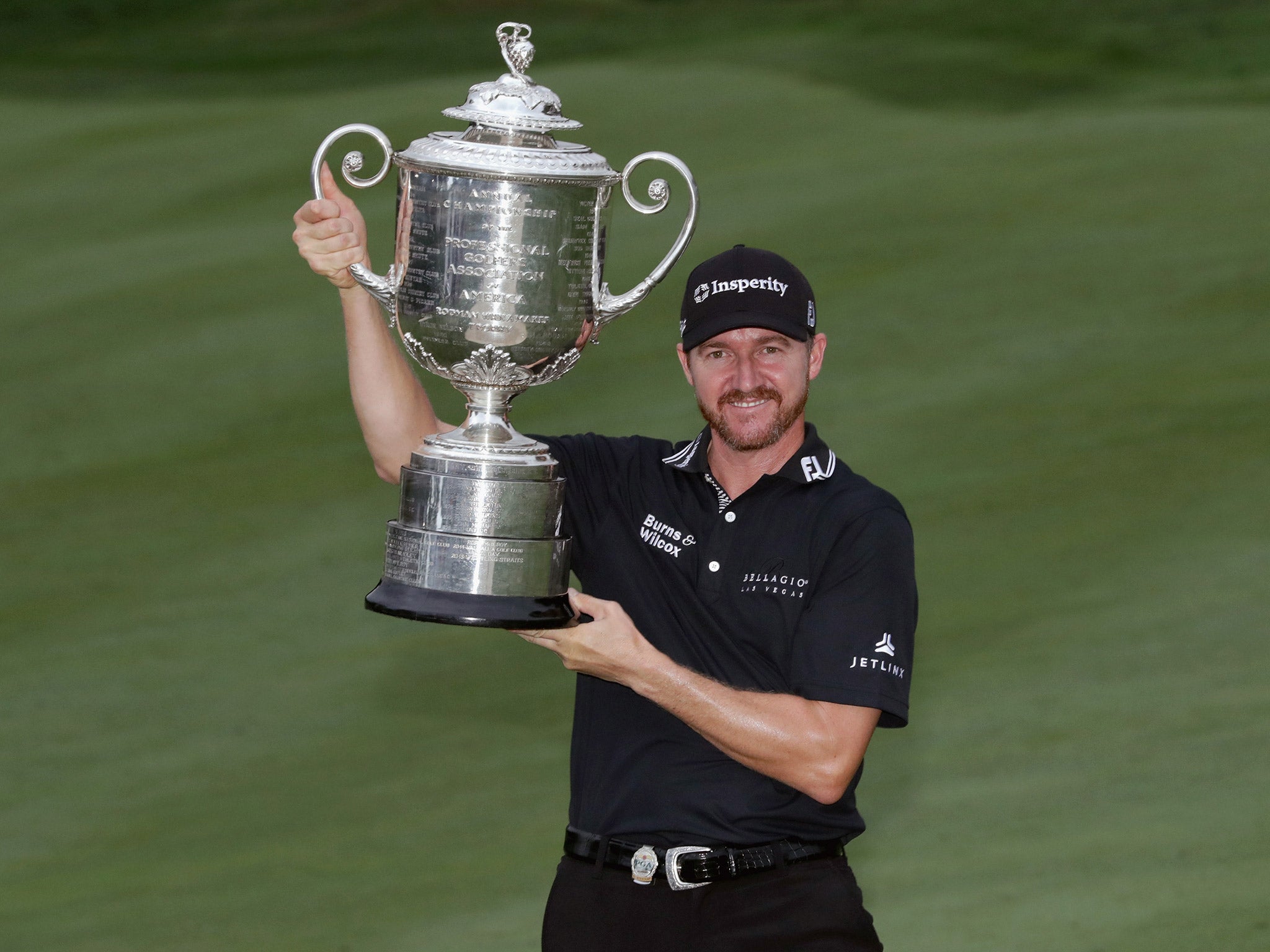 Jimmy Walker holds the Wanamaker Trophy after winning the PGA Championship at Baltusrol