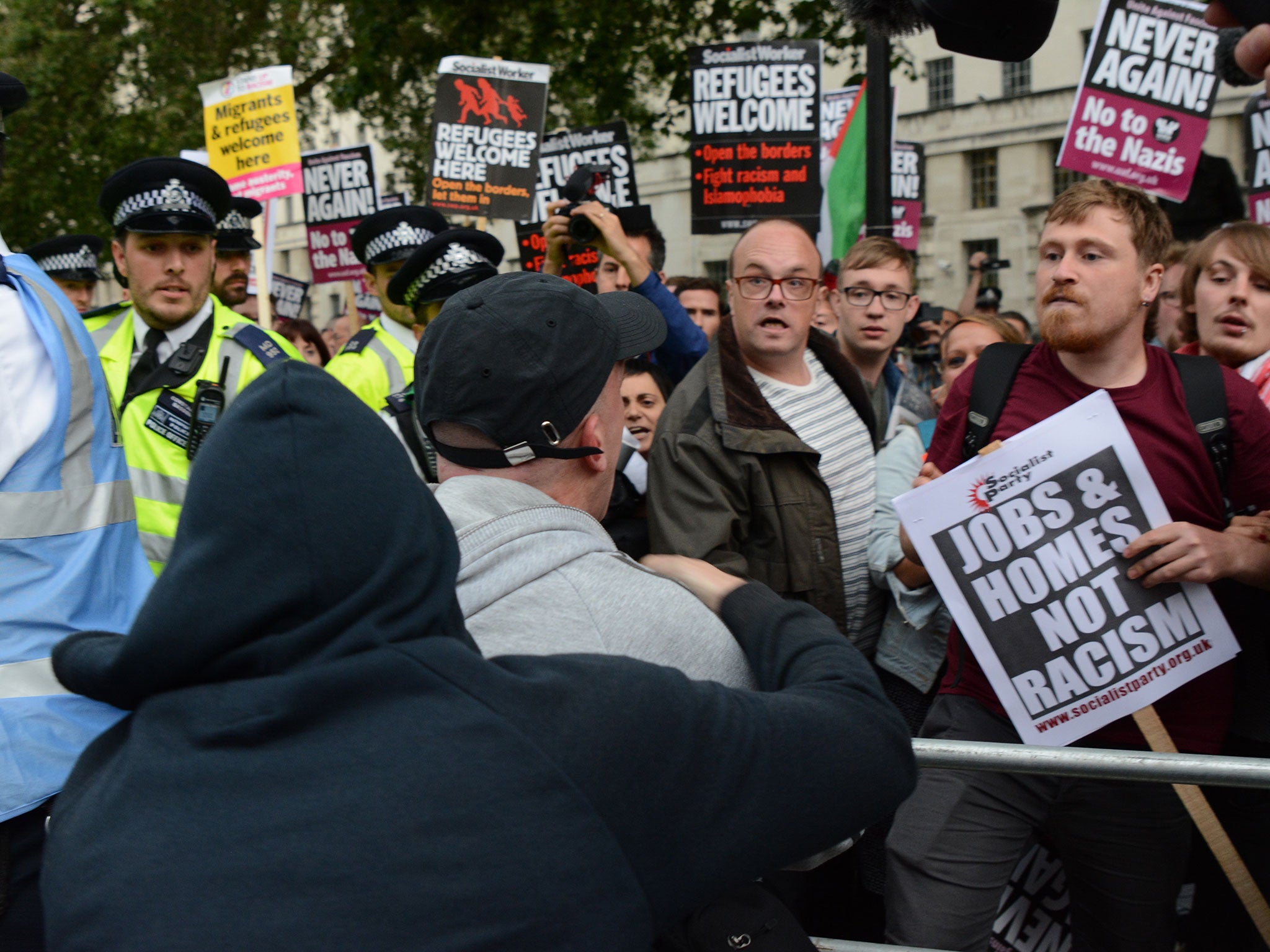 Scuffles break out at a protest and counter-protest over the triggering of Article 50 to begin Brexit outside Downing Street in London on 29 July 2016