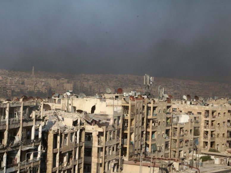 A general view shows rising smoke from burning tyres in Aleppo, Syria August 1, 2016