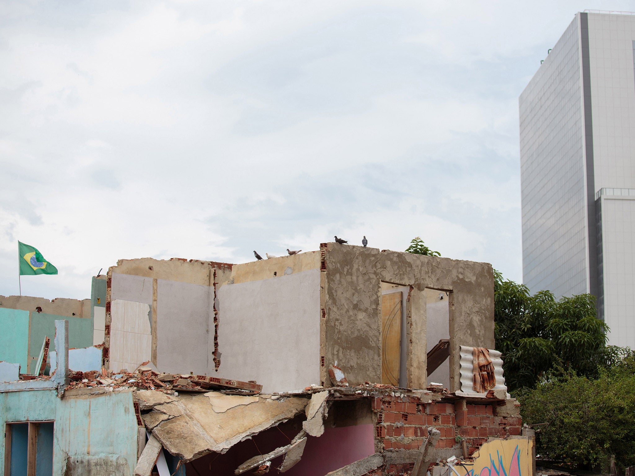 Buildings in the Olympic Park are seen from the Vila Autodromo neighbourhood of Rio de Janeiro, Brazil