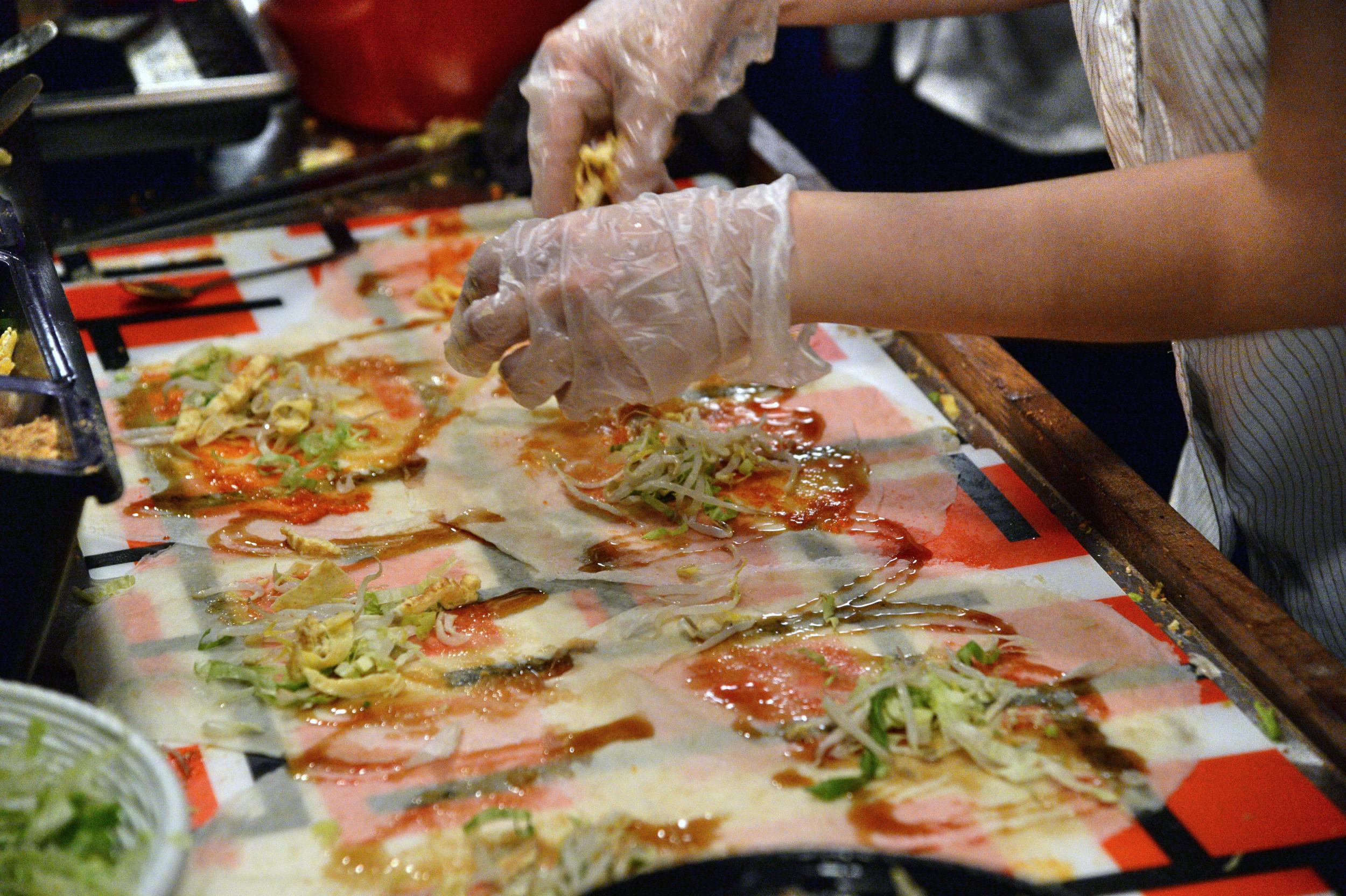 Popiah is a staple Singapore food snack, stuffing as much as possible into a papery crêpe