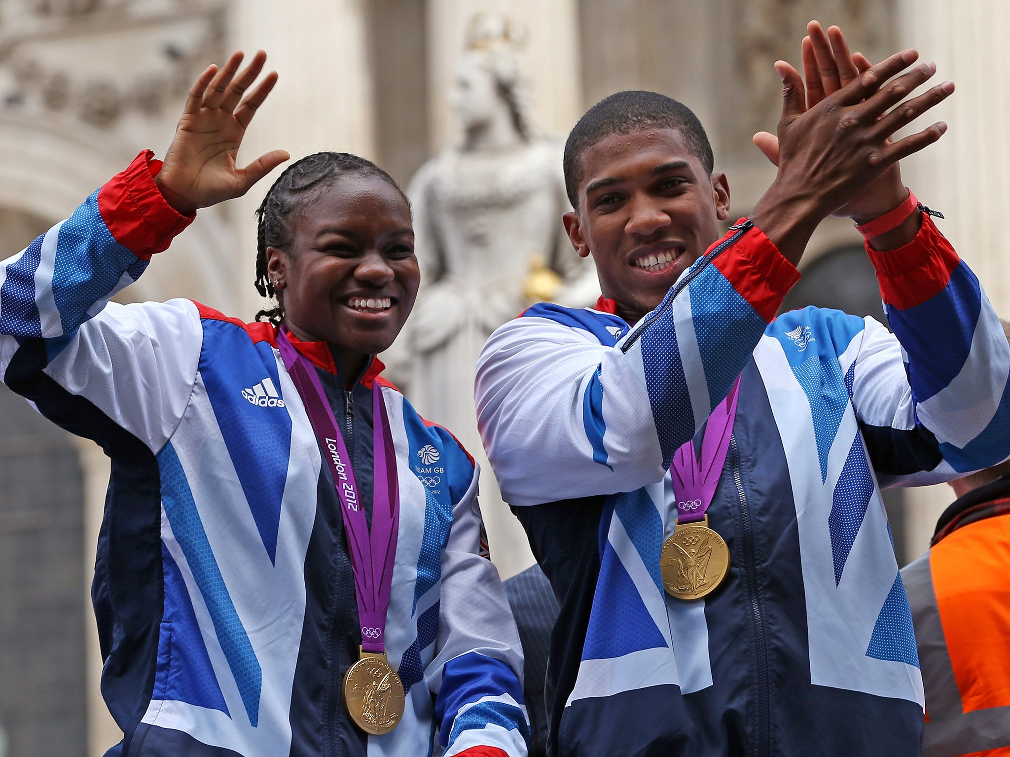 Adams and Joshua with their gold medals on the 2012 victory parade