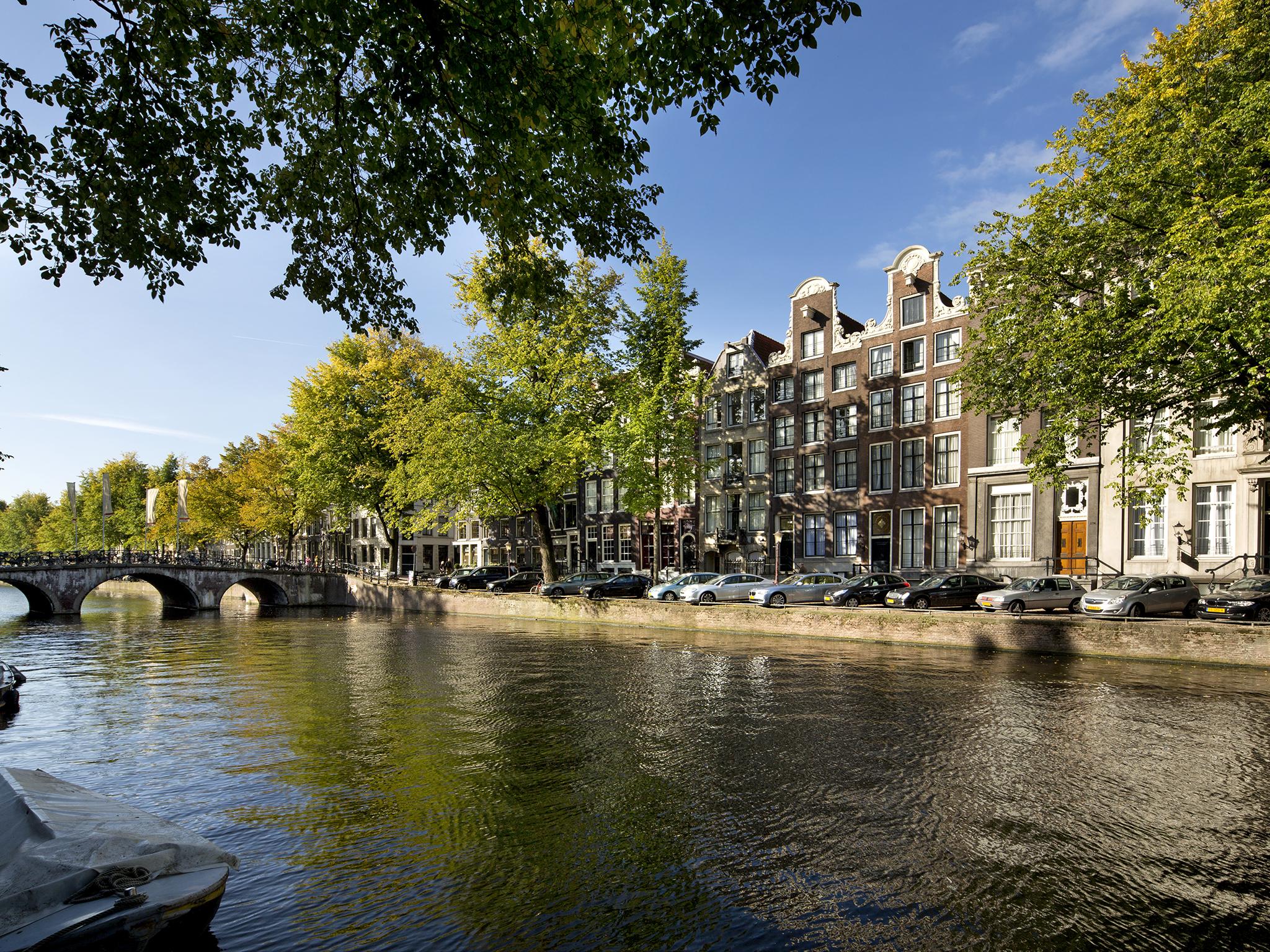 Enjoy stunning views of Amsterdam's canals from the comfort of your own luxury suite.