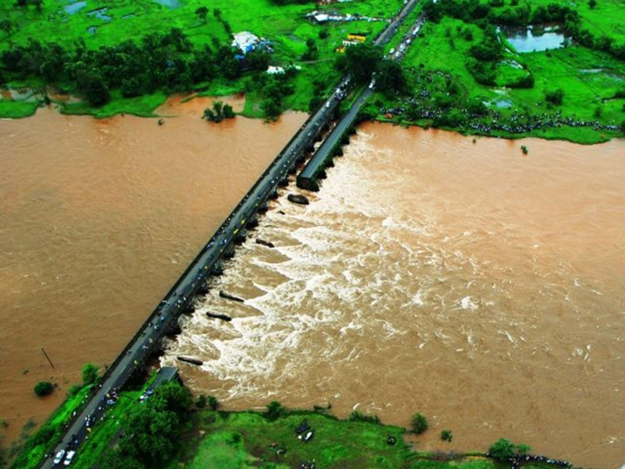 The old bridge on the Mumbai-Goa highway collapsed in a flooded river in western Maharashtra state in India around midnight on Tuesday, 2 August, 2016