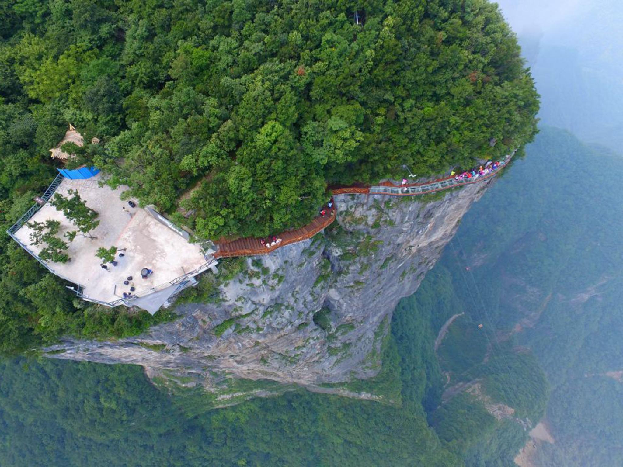The 100-metre-long walk gives a clear view of the deep valley behind and is the third glass walkway in the scenic zone
