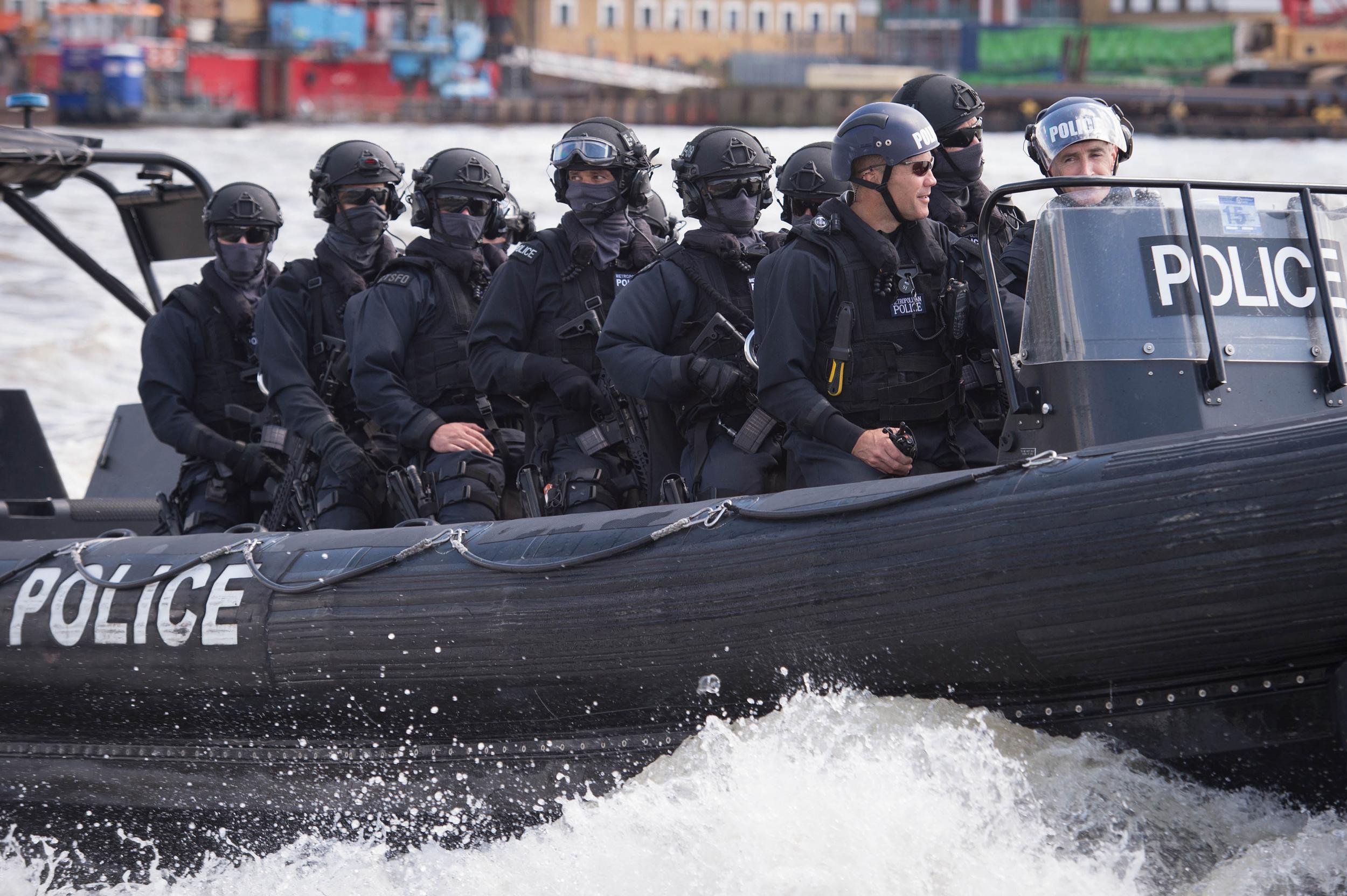 Armed Metropolitan Police counter-terrorism officers taking part in an exercise on the River Thames