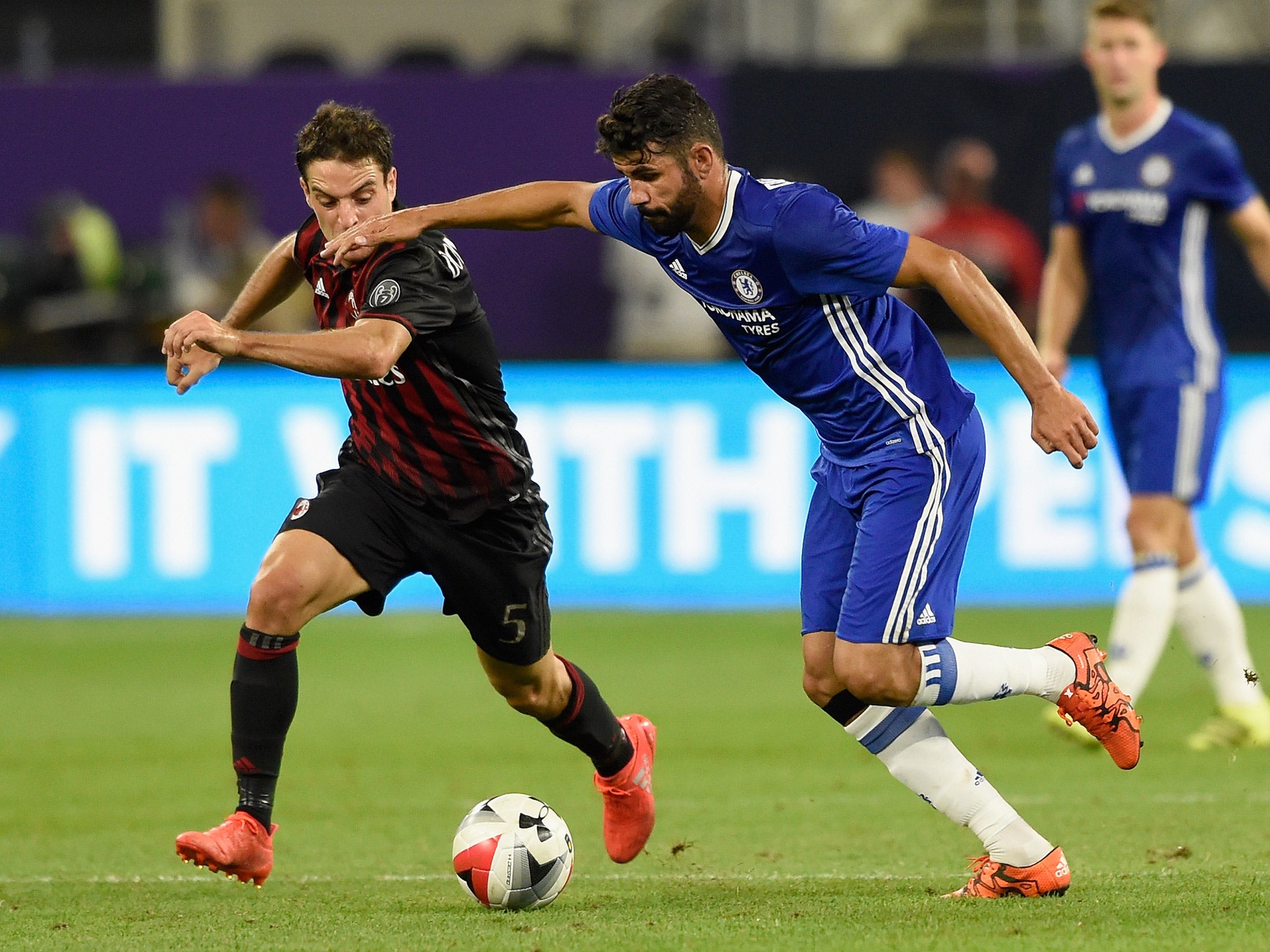 Diego Costa battles for possession with Giacomo Bonaventura