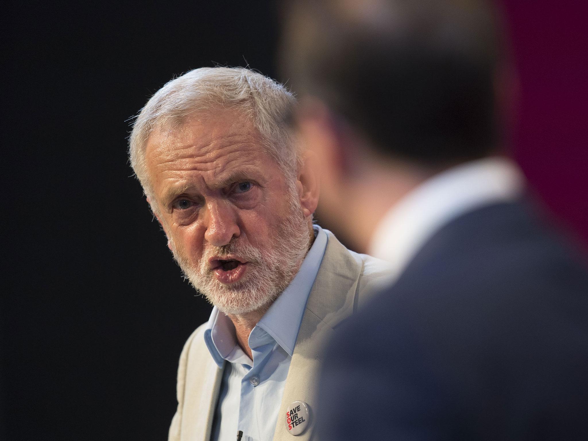 Jeremy Corbyn and Owen Smith (right) clash during their first leadership debate in Cardiff