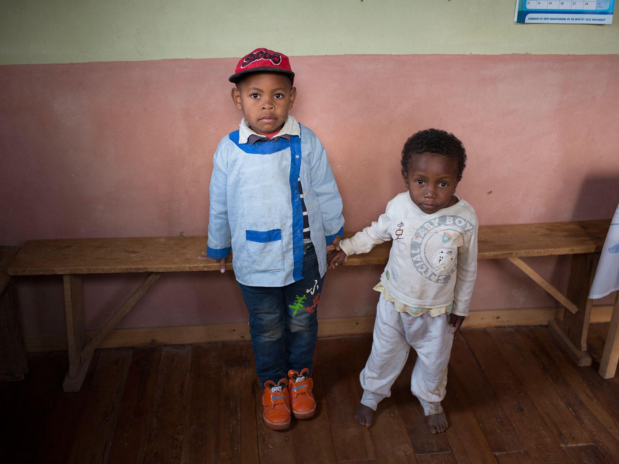 While Miranto (L) and Sitraka were born on the same day, the difference between them caused by chronic malnutrition is stark