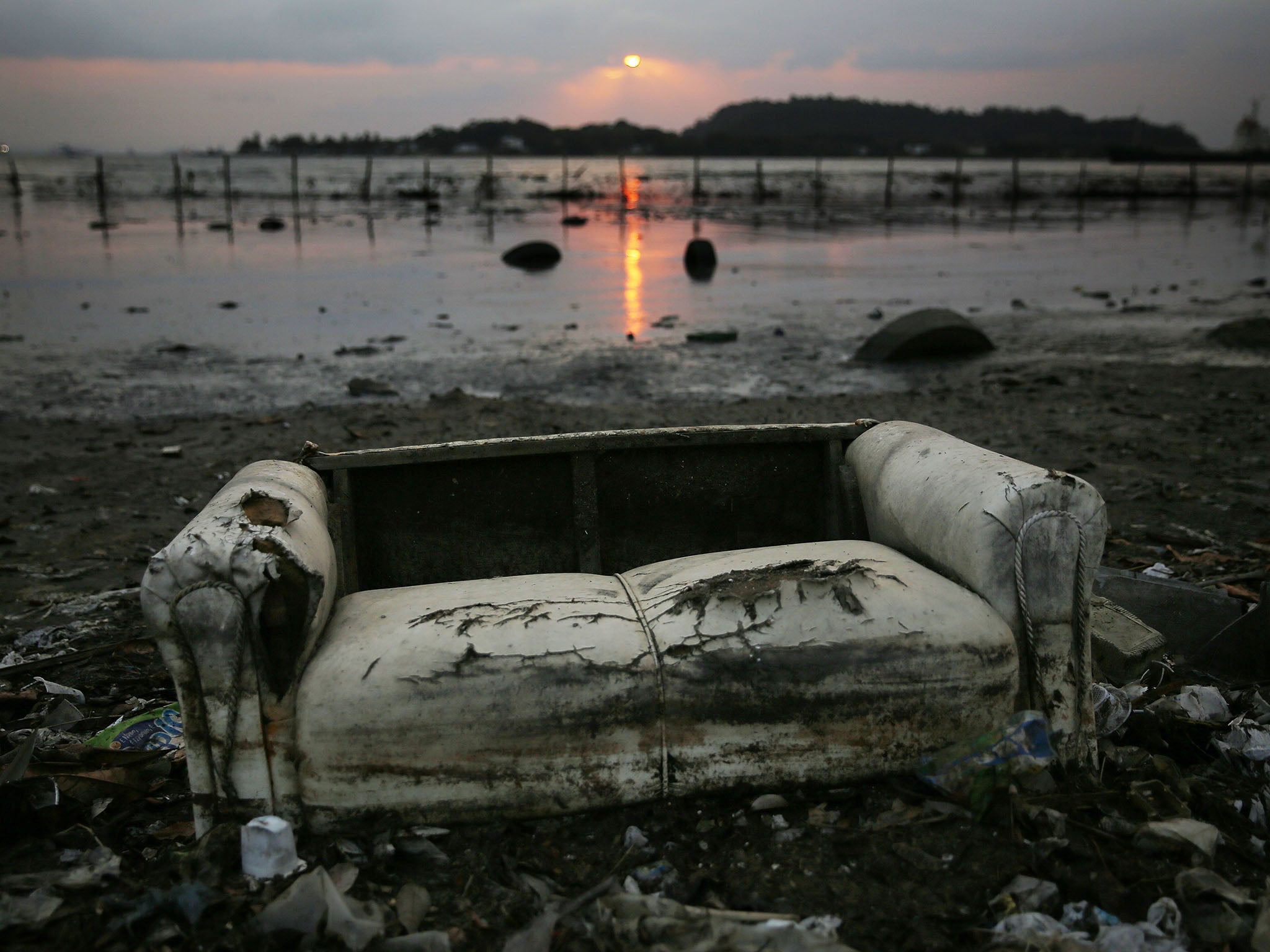 The reports that a kayaker may have struck a sofa are so far unconfirmed. Pictured: A sofa dredged up on the side of Guanabara Bay, where the sailing events are taking place, on 2 August 2016