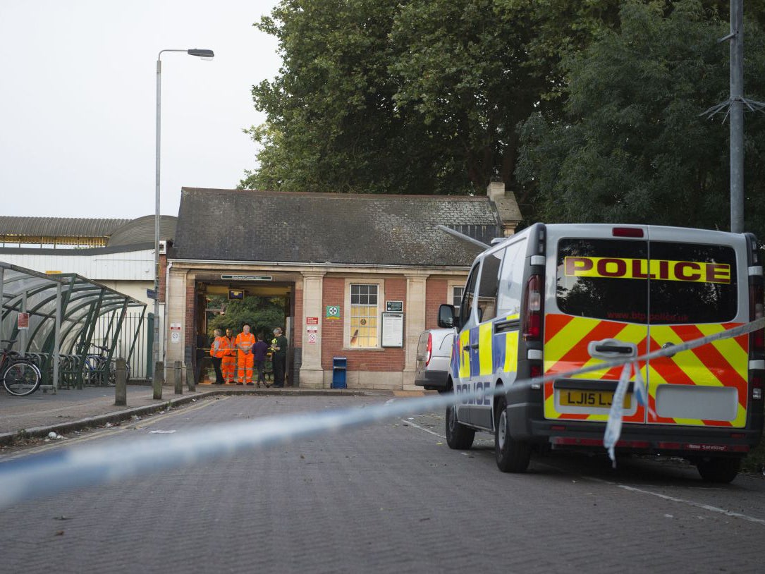 Police cordon outside Wandsworth station after the man was killed when he leant out of the carriage