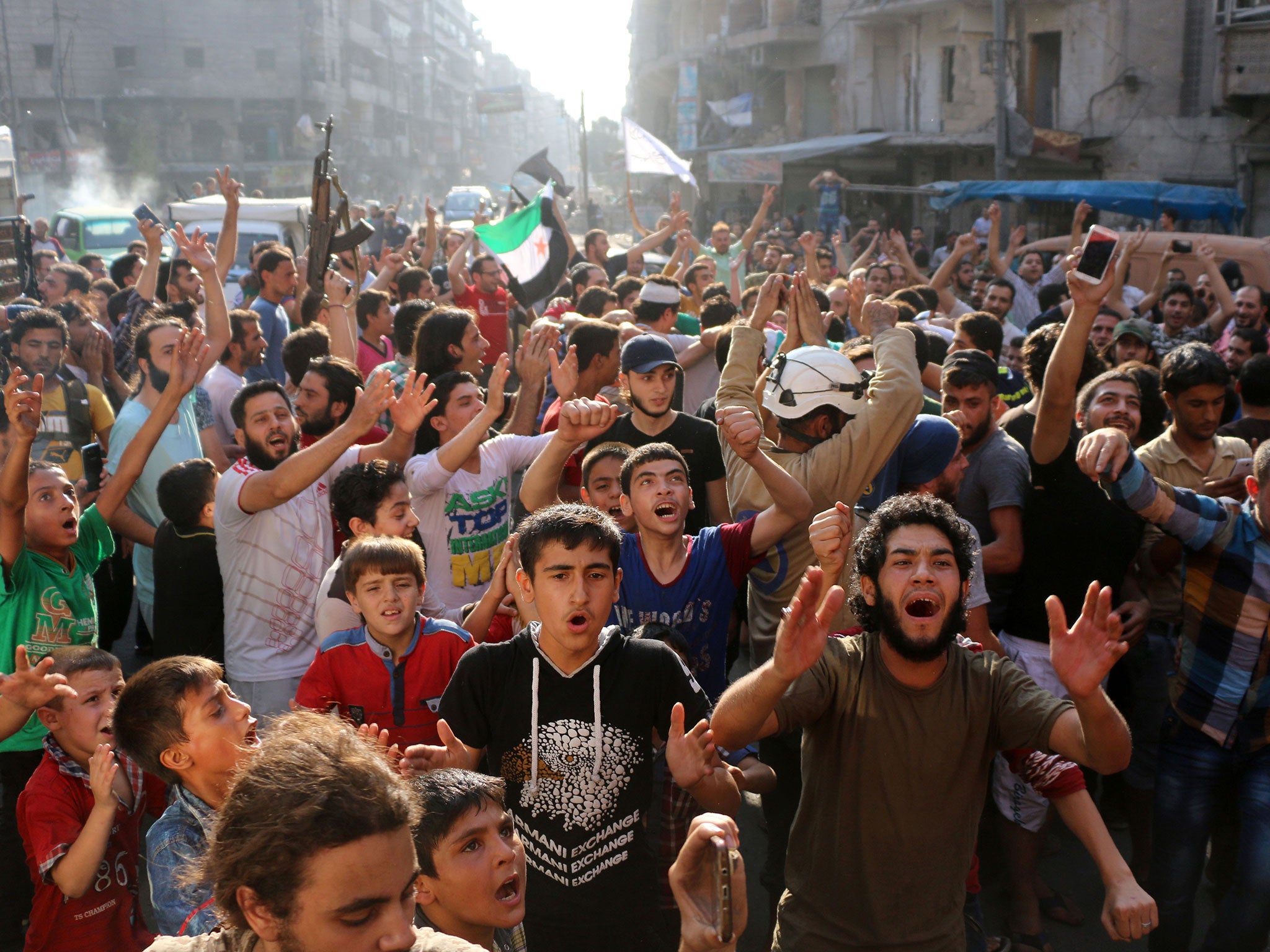 Syrian gather in Aleppo in celebrations after rebels said they have broken a three-week government siege