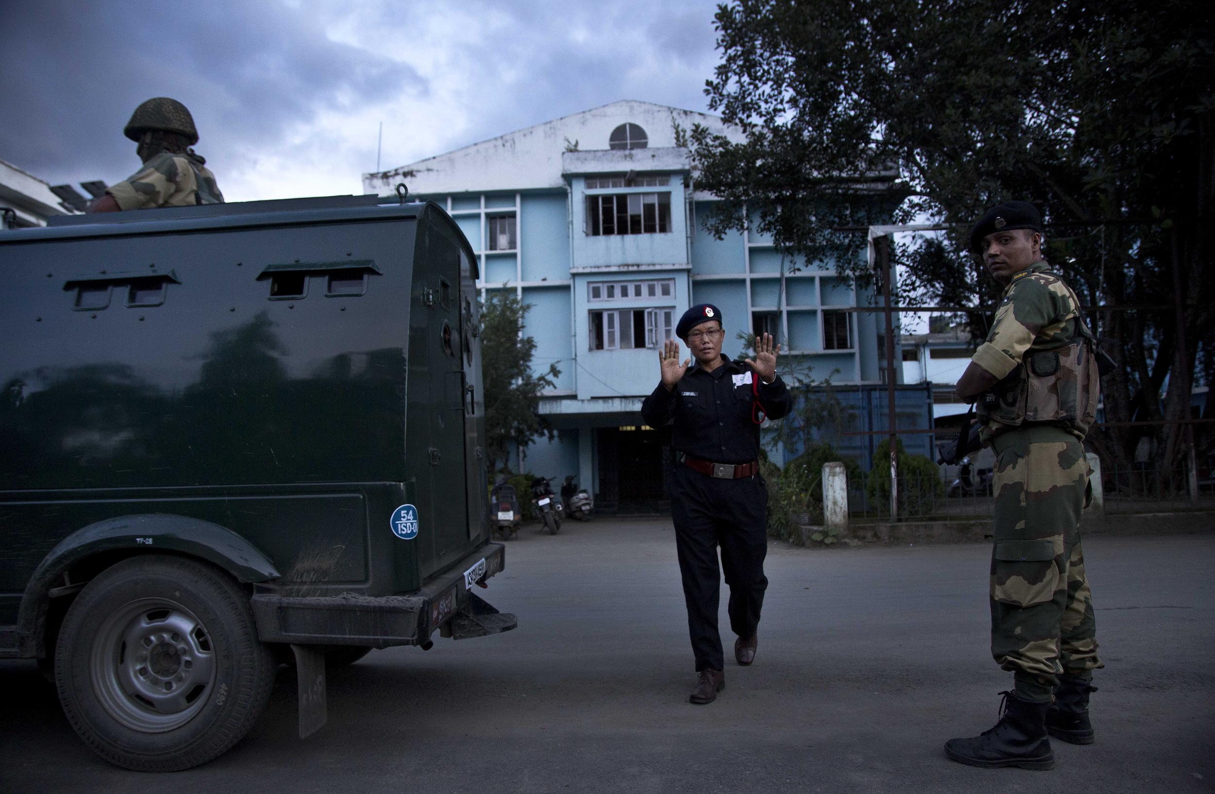 Security and a bulletproof vehicle keep vigil outside the Jawaharlal Nehru hospital where Indian activist Irom Sharmila has been kept while on hunger strike