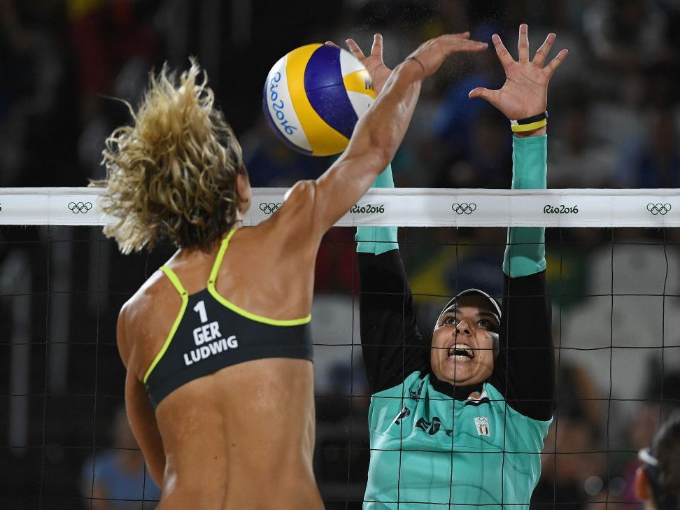 Germany's Laura Ludwig (L) vies with Egypt's Doaa Elghobashy during the women's beach volleyball