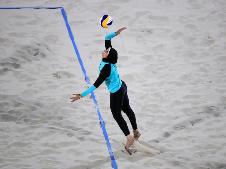 Egypt's Doaa Elghobashy serves during a beach volleyball match at the Beach Volleyball Arena