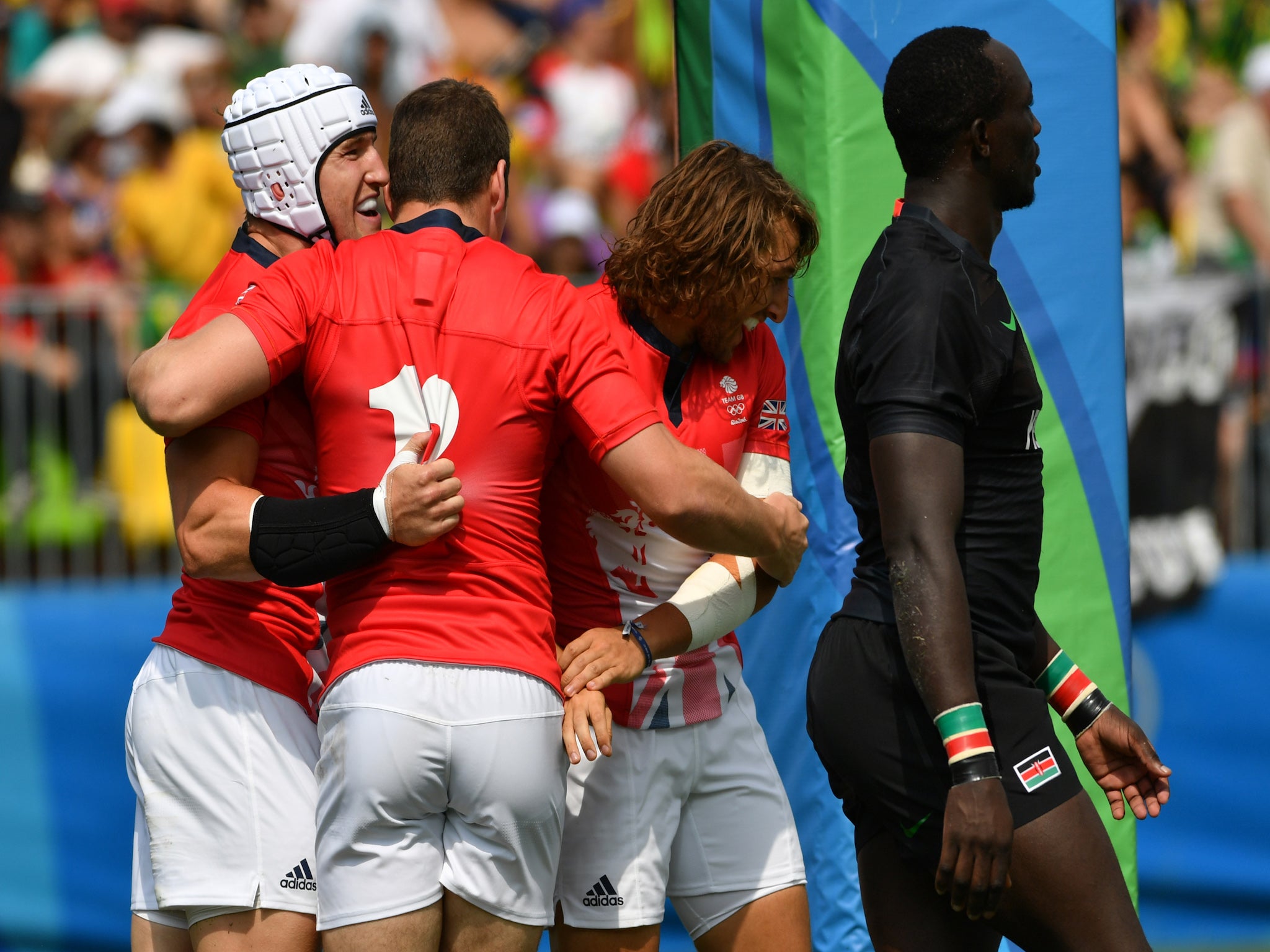 Britain's Phil Burgess celebrates his try in the victory against Kenya