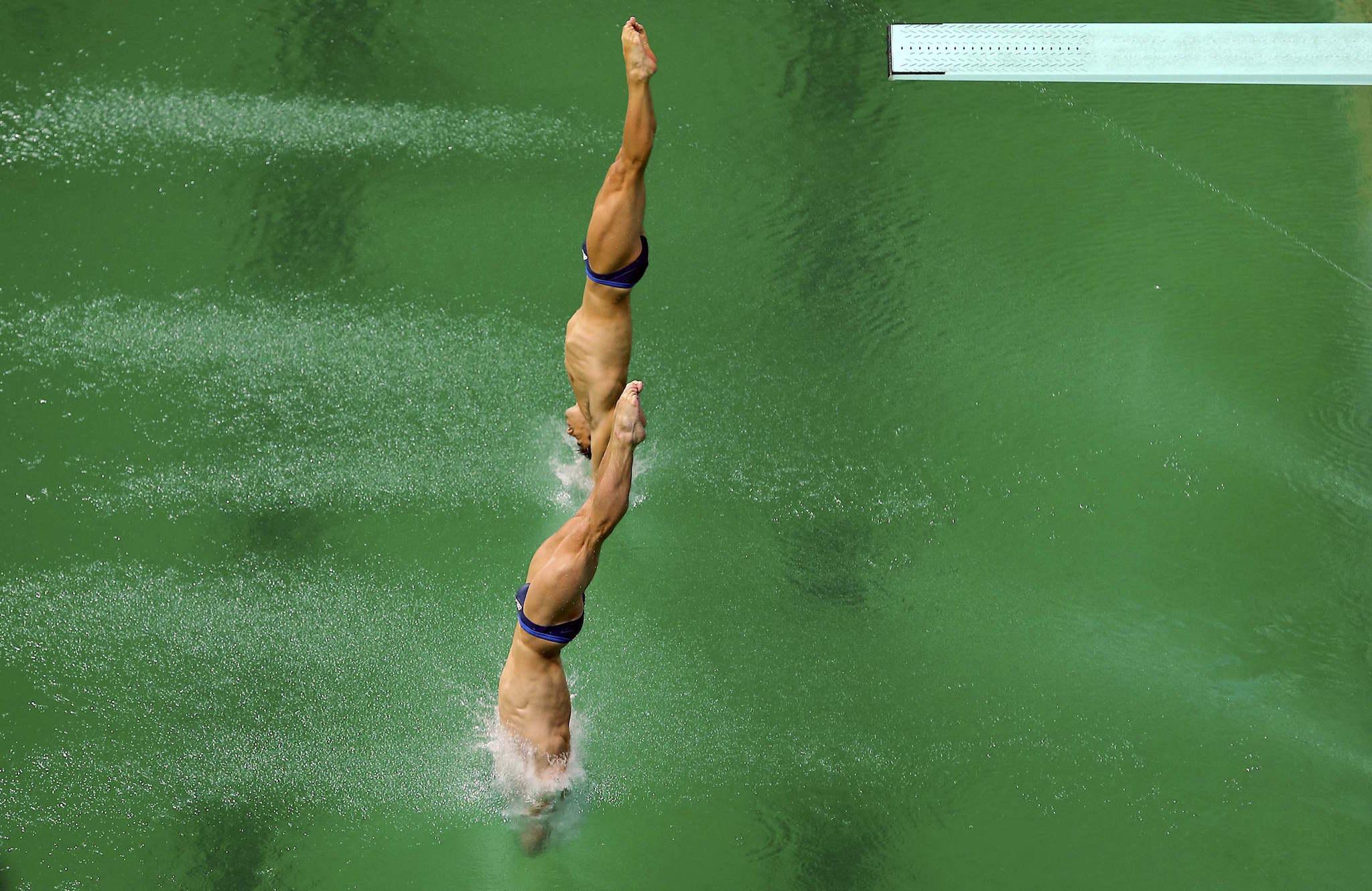 Jack Laugher and Chris Mears of United Kingdom jump into the lush pool