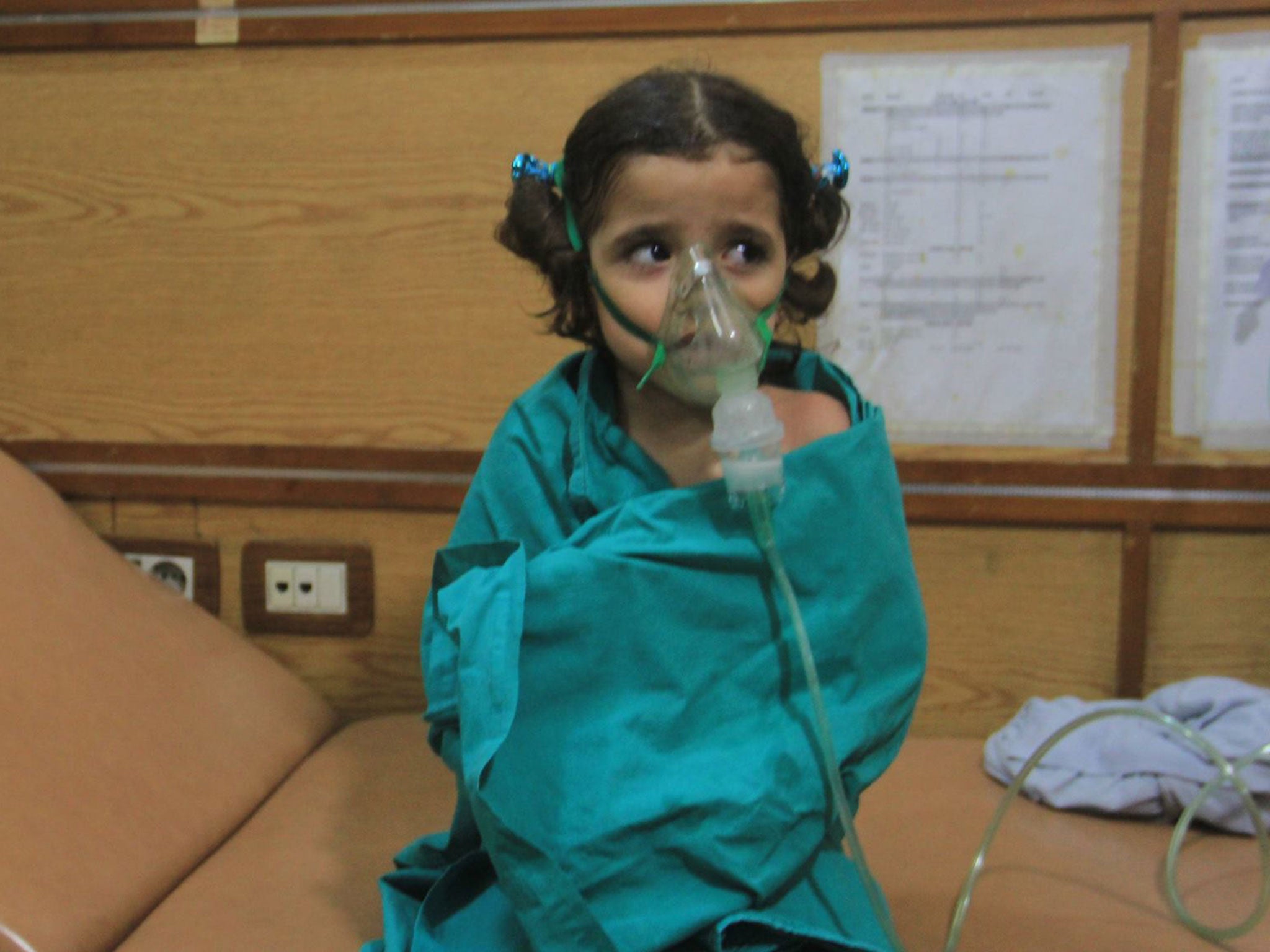 &#13;
Children were given emergency treatment and oxygen masks after the attack in Aleppo &#13;