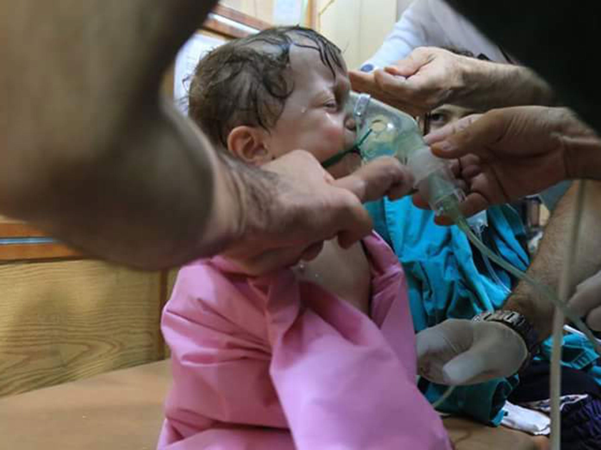 A patient with a hospital mask at al-Quds hospital in Aleppo after a reported chlorine gas attack