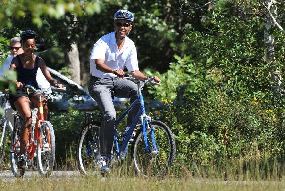 The president enjoying his summer holiday with his daughters