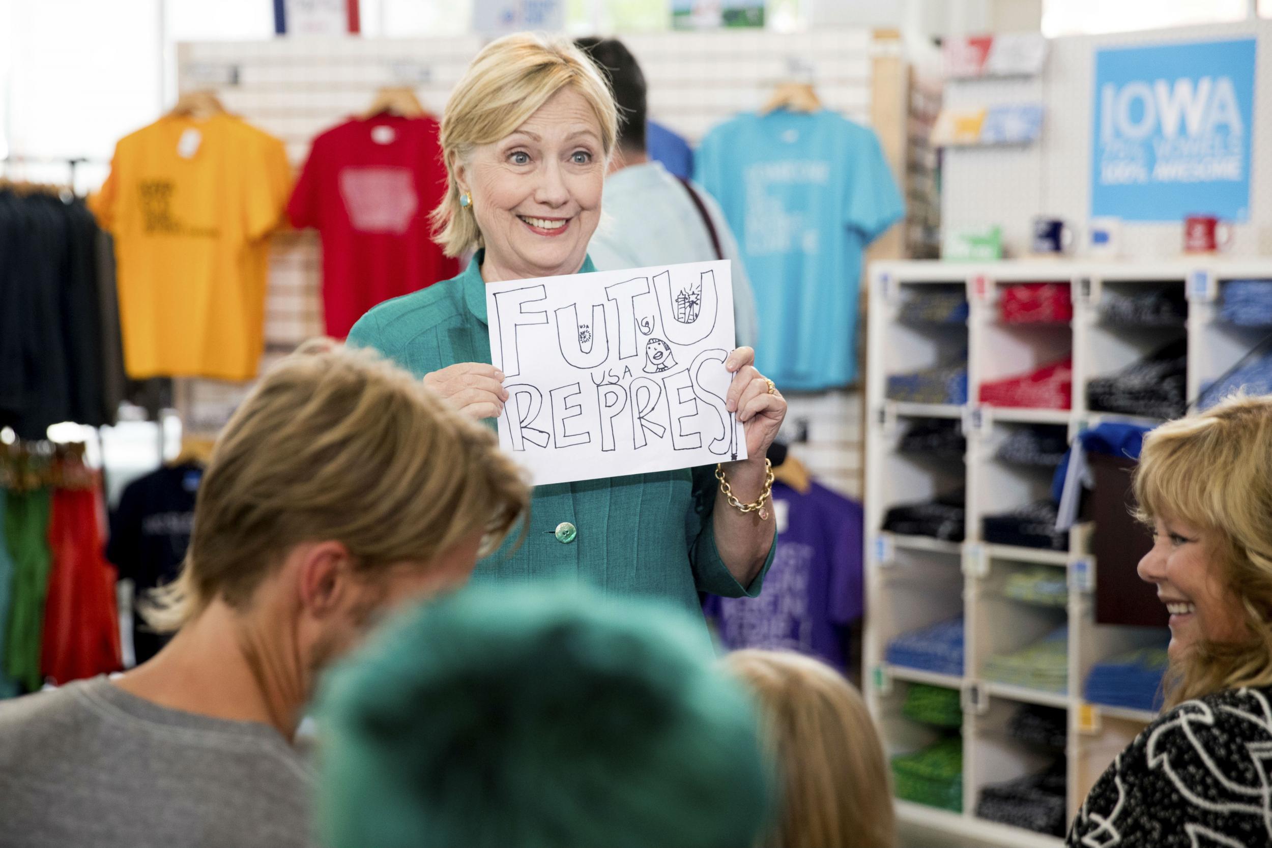 Ms Clinton holds a sign saying 'Future President'