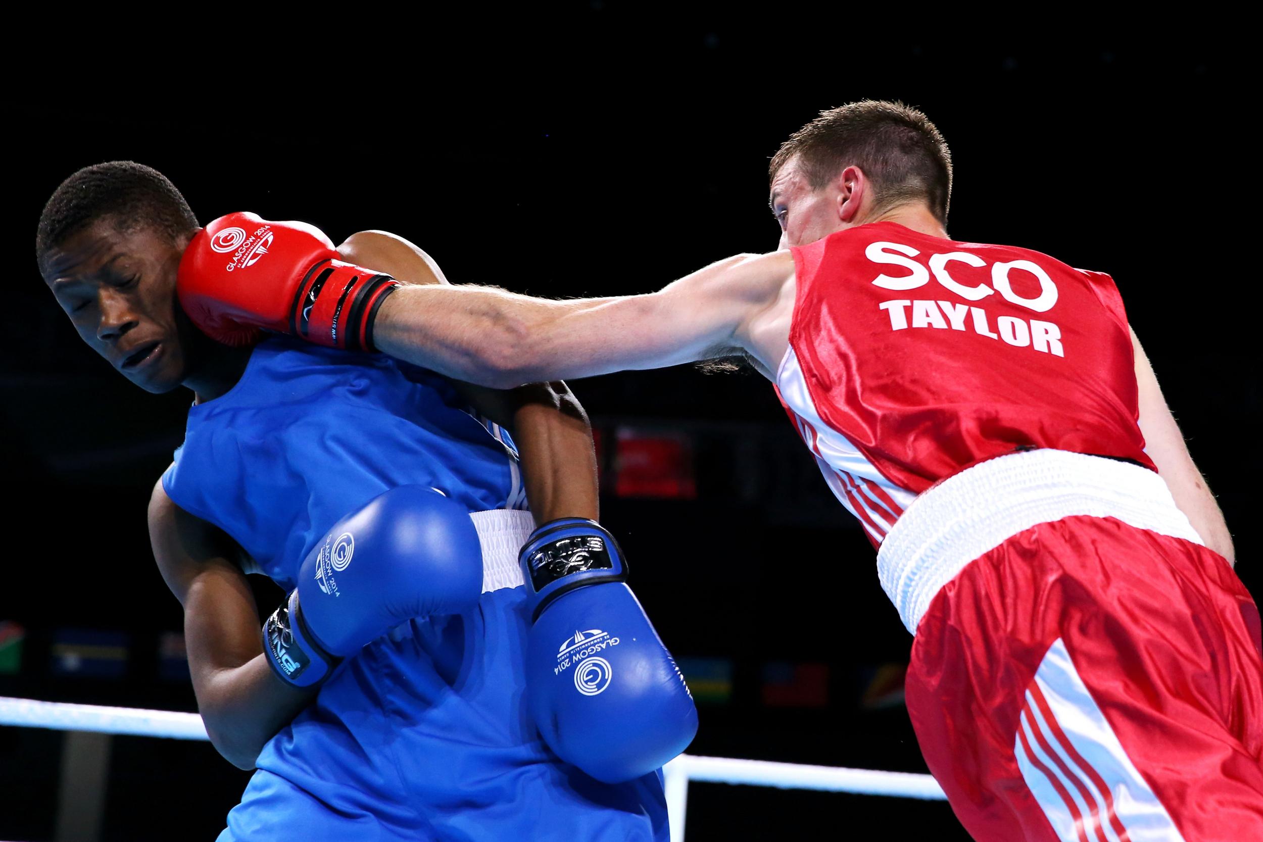 Junias Jonas (left) fighting in the Glasgow 2014 Commonwealth games