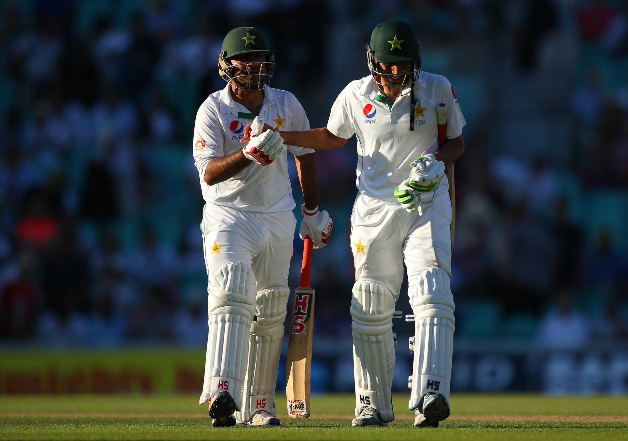 Younis Khan and Asad Shafiq congratulate one another