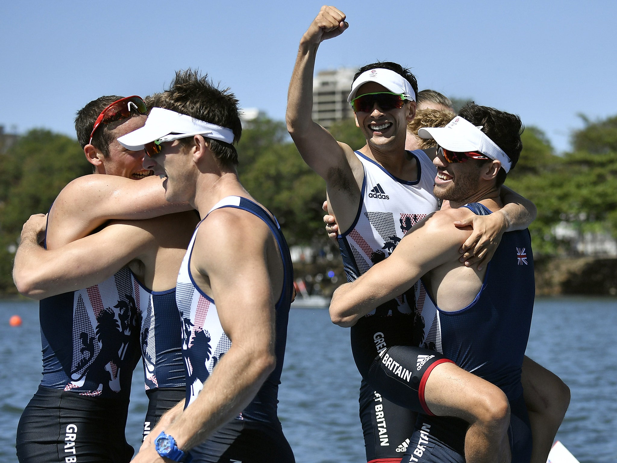 Members of Team GB's men's eight celebrate their gold medal success