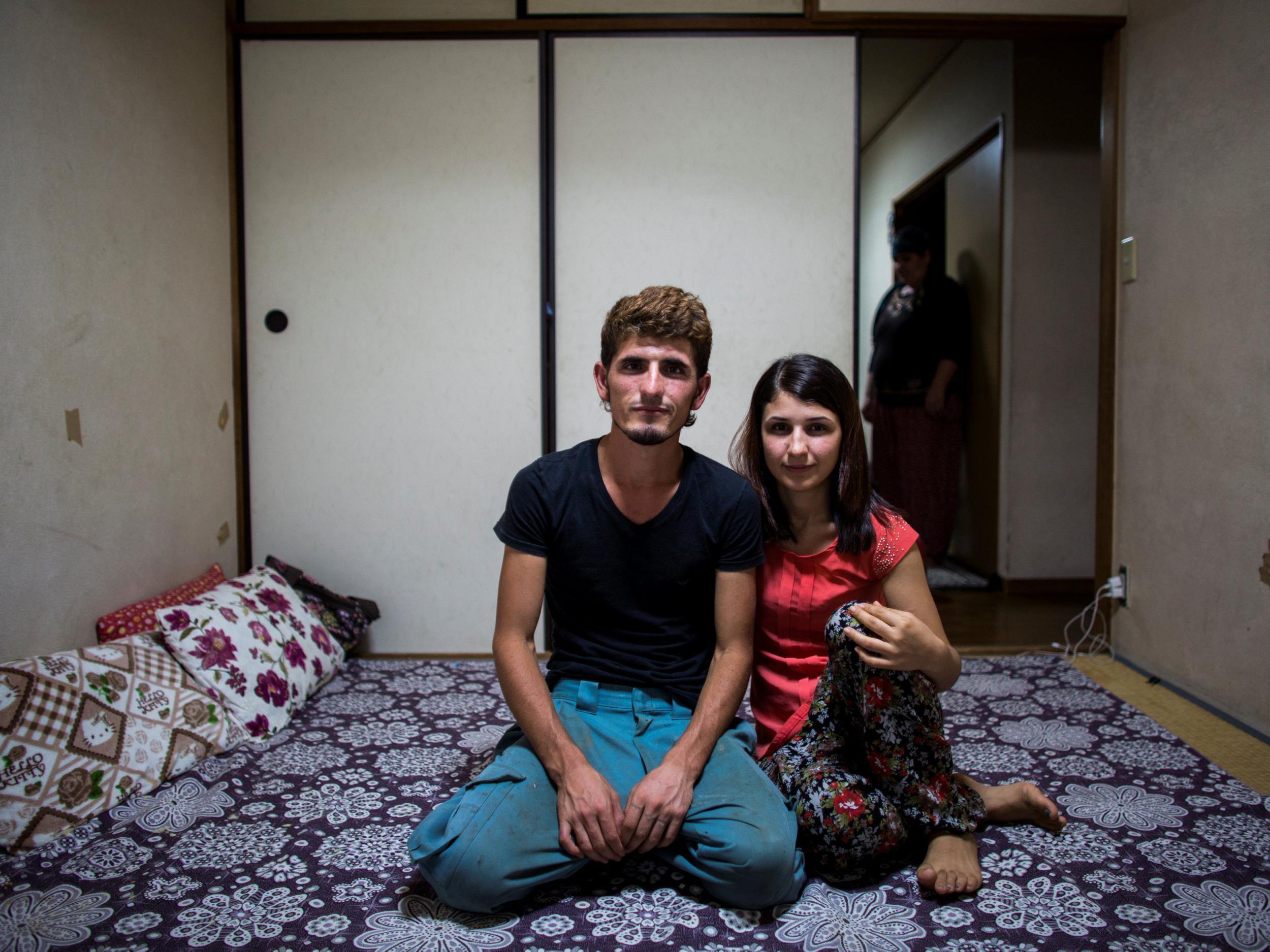 Mazlum Balibay, 23, and his sister Suzan at their home in Warabi, north of Tokyo