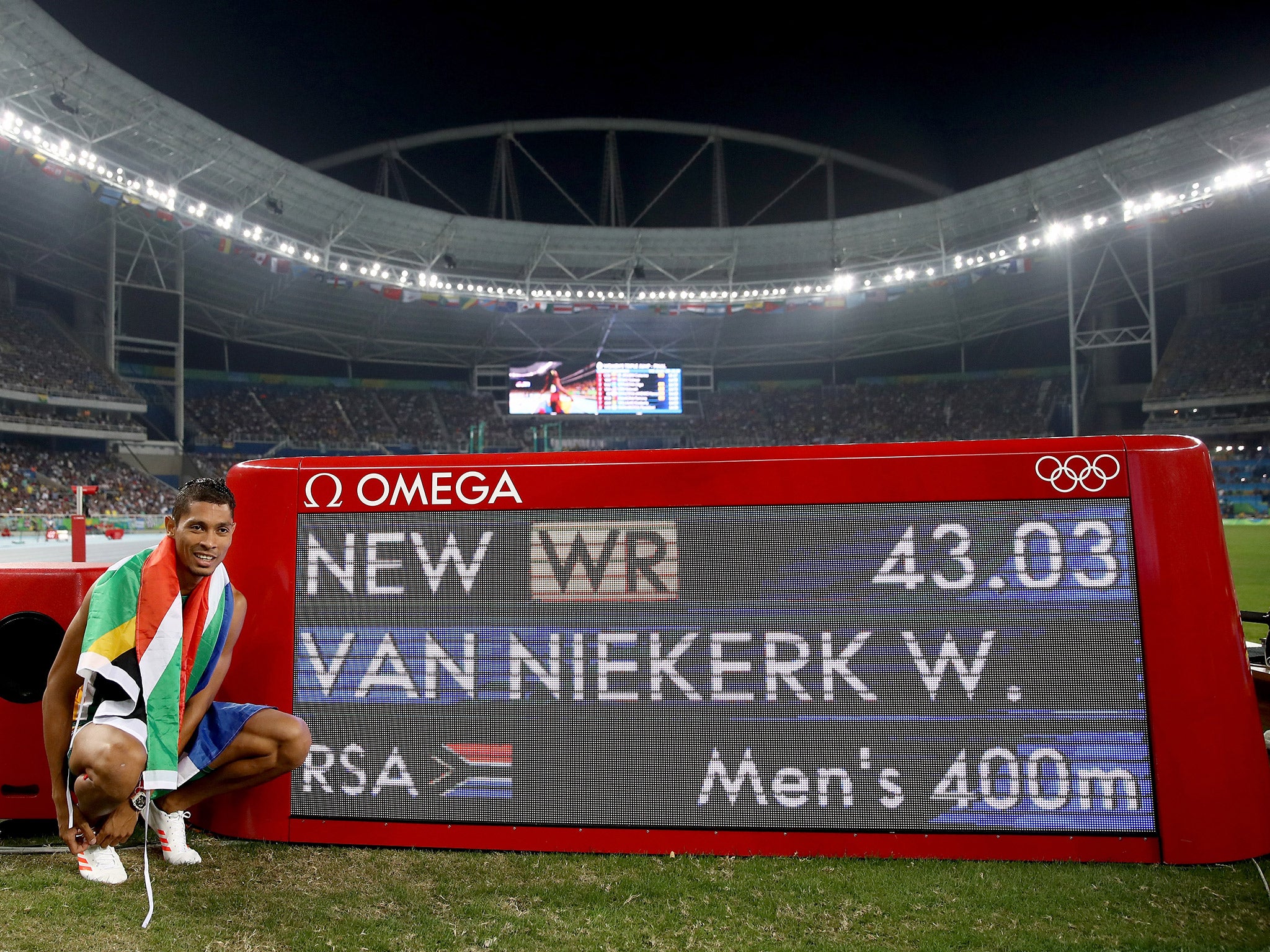 Wayde van Niekerk celebrates his world record time in winning gold in the 400m final