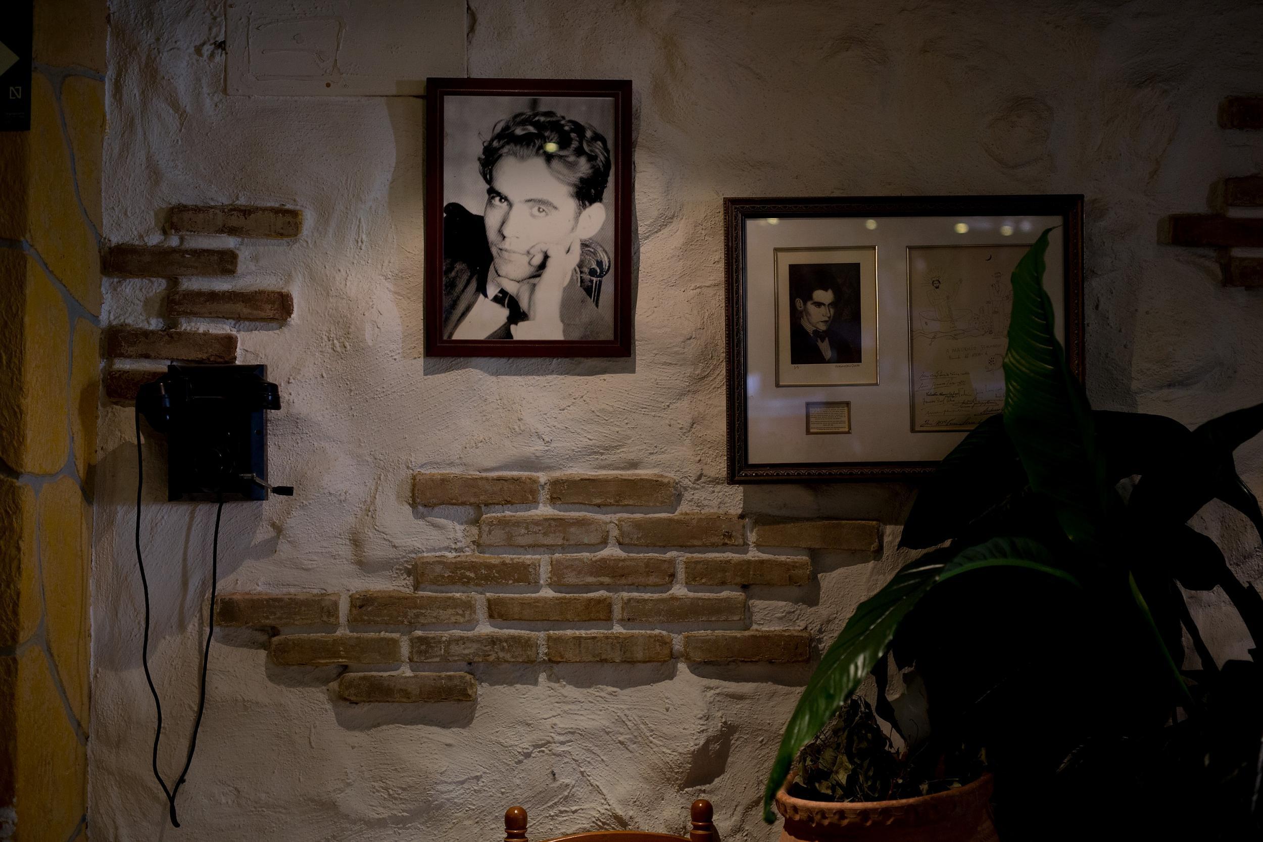 A portrait of Federico Garcia Lorca hangs in a local restaurant. While Franco was not invested in preserving Lorca's works, today Andalusians are honouring his memory with museums and re-runs of his plays