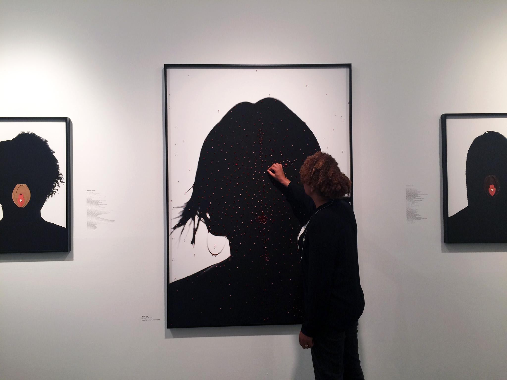 Silvestri (pictured) asks visitors to place a pin in one of the exhibit’s silhouettes as a show of support for FGM survivors