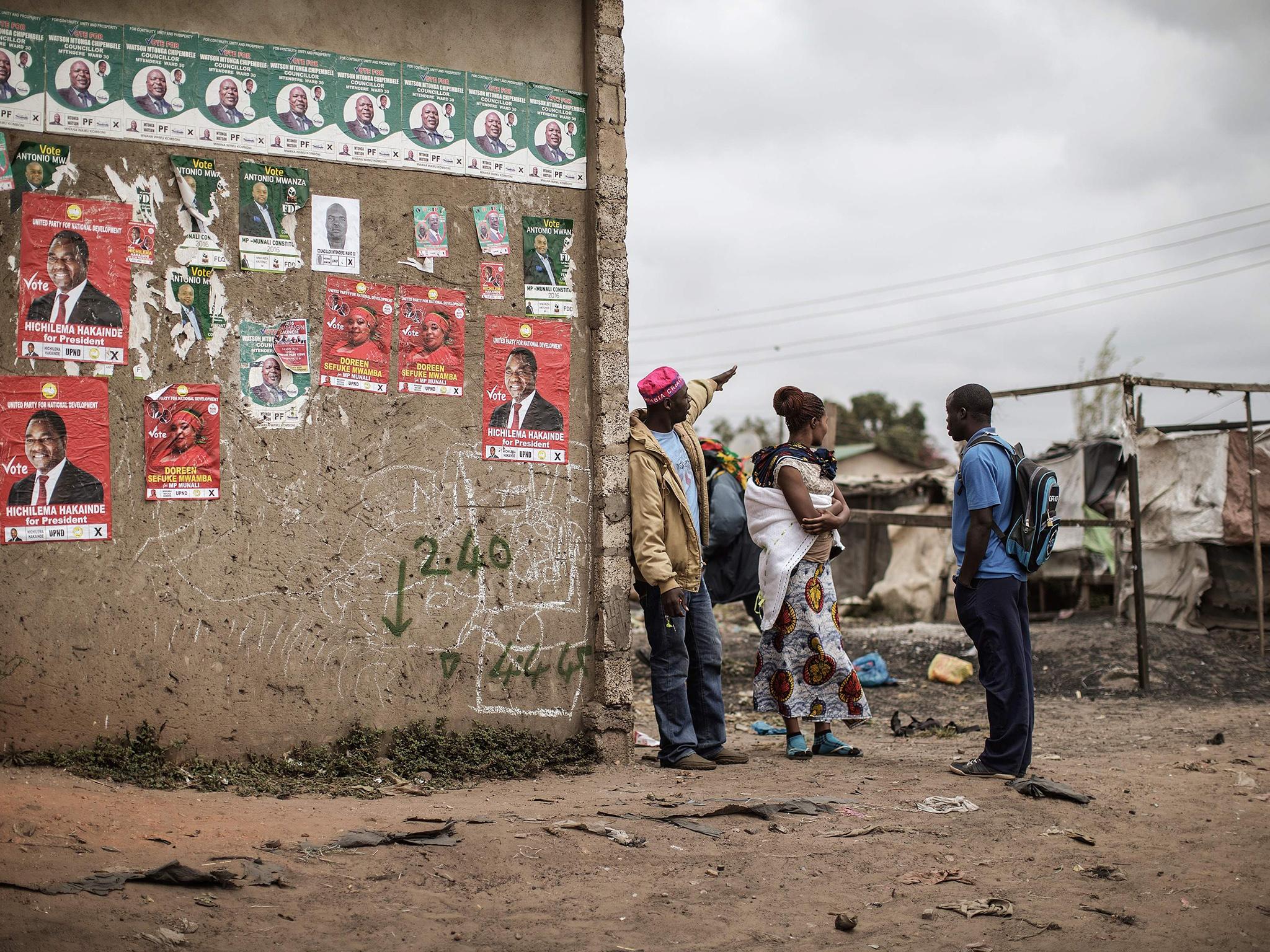 Supporters of the main Zambian opposition party gather before a campaign rally