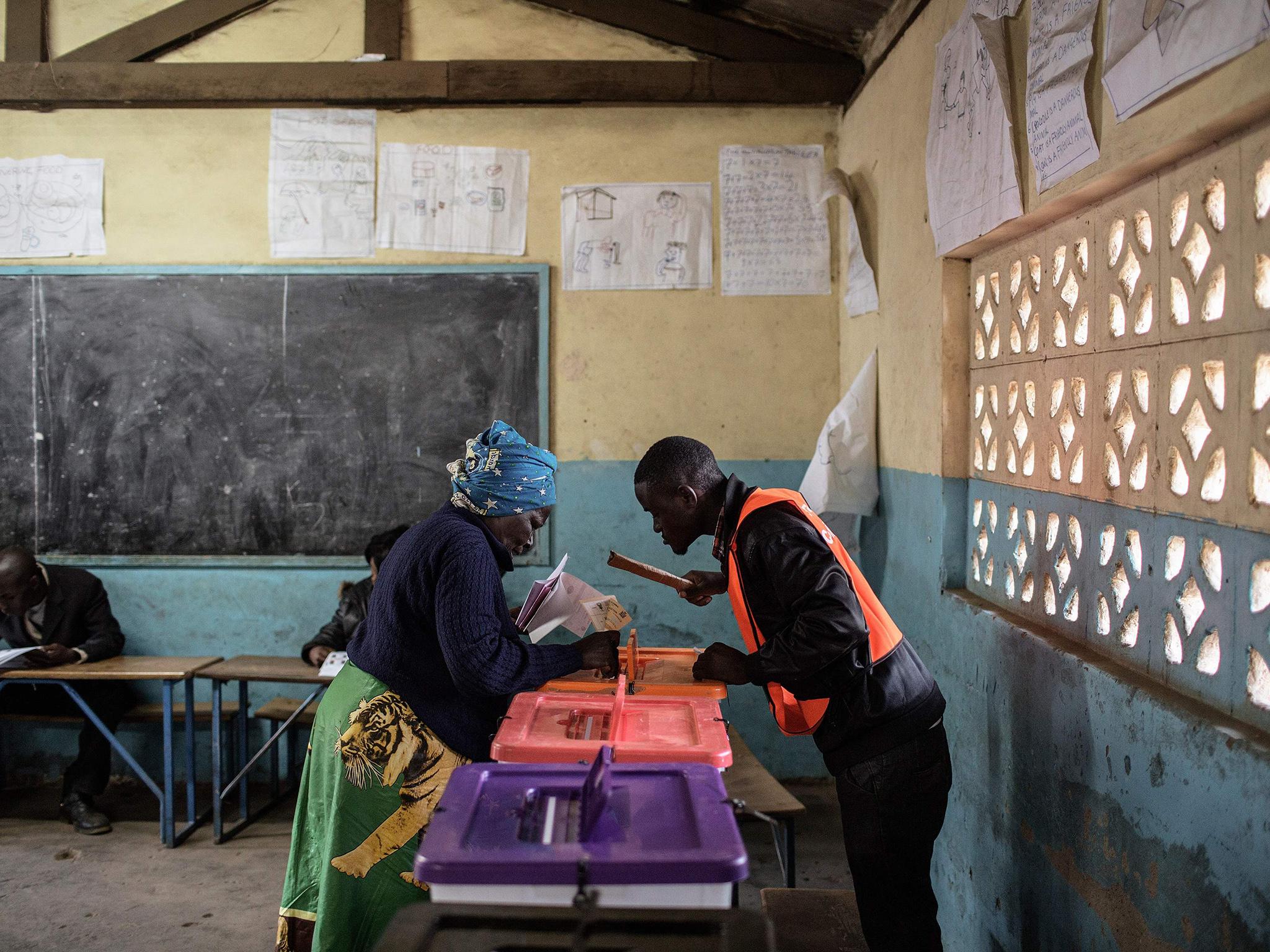 A Zambian woman casts her ballot at Kanyama Basic School voting station in Lusaka, during the Zambian general election