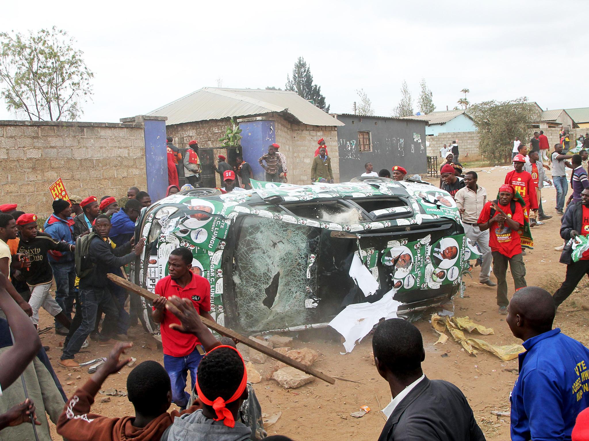 Supporters of the UPND clash with PF supporters after being prevented from joining a rally