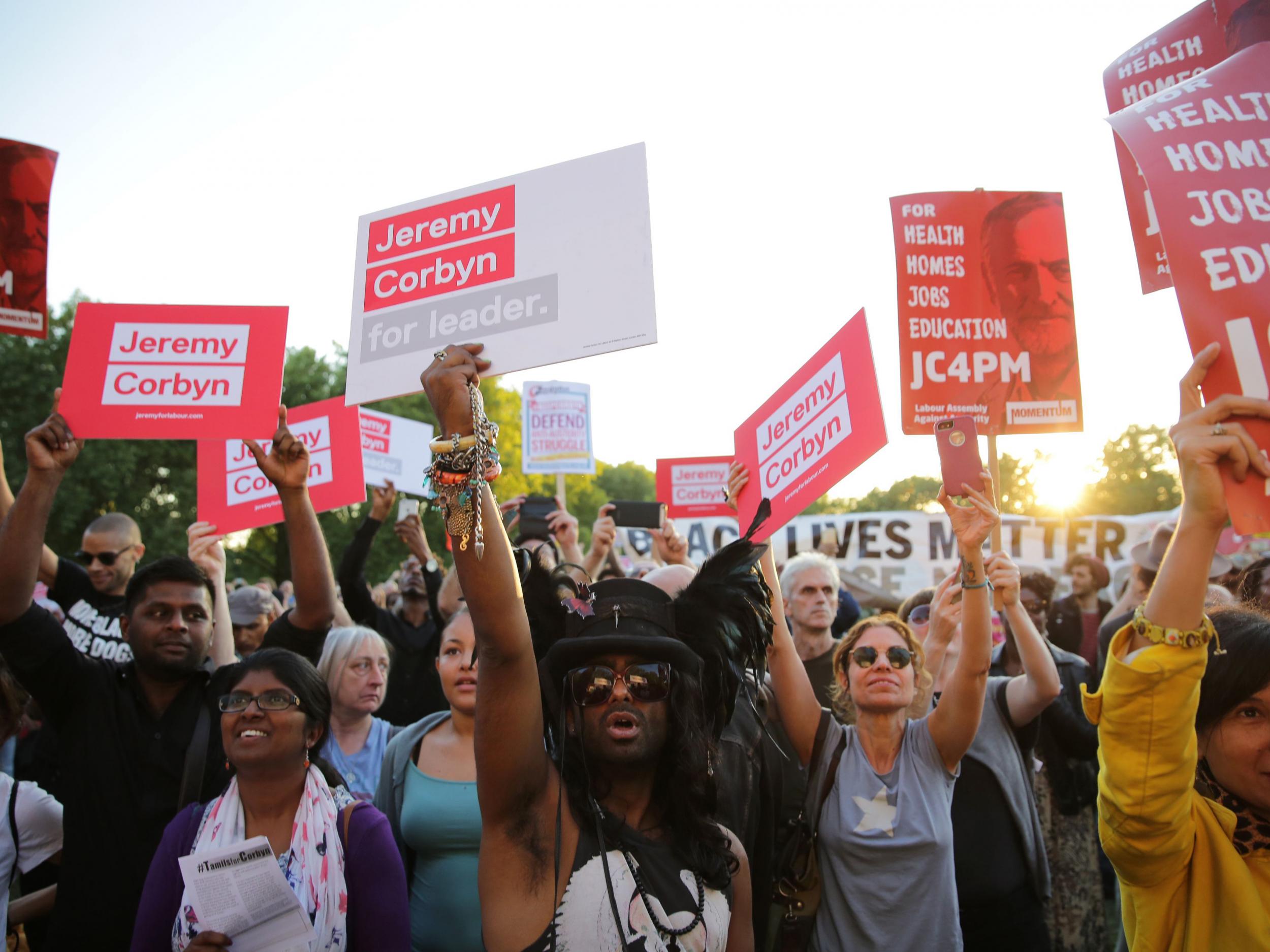 Supporters of Jeremy Corbyn hold up placards and cheer at a Black, Asian and minority ethnic (BAME) rally in north London