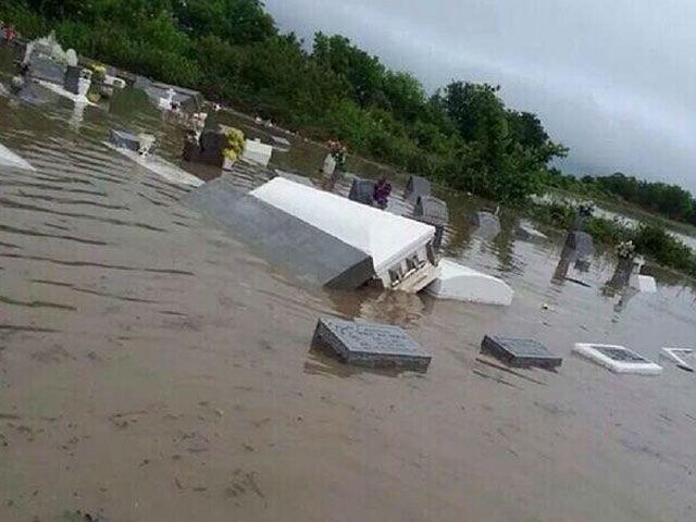 The record flooding has loosened coffins