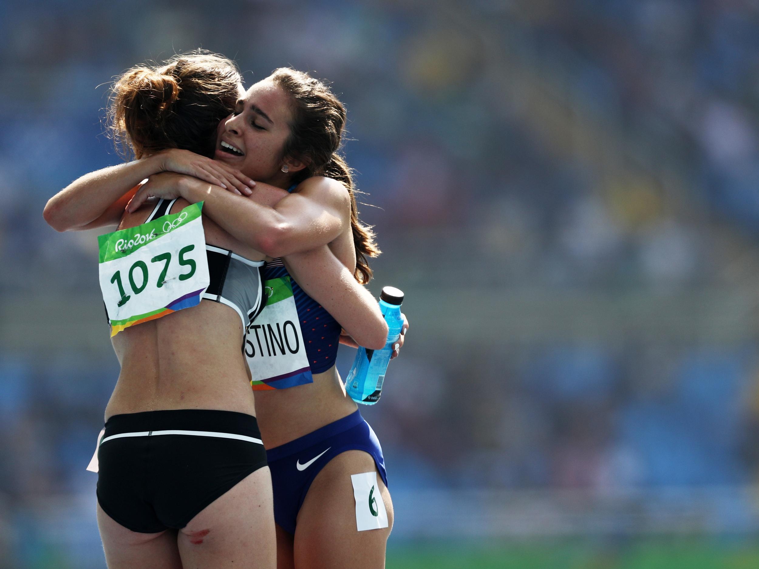 Abbey D'Agostino of the United States (R) hugs Nikki Hamblin of New Zealand