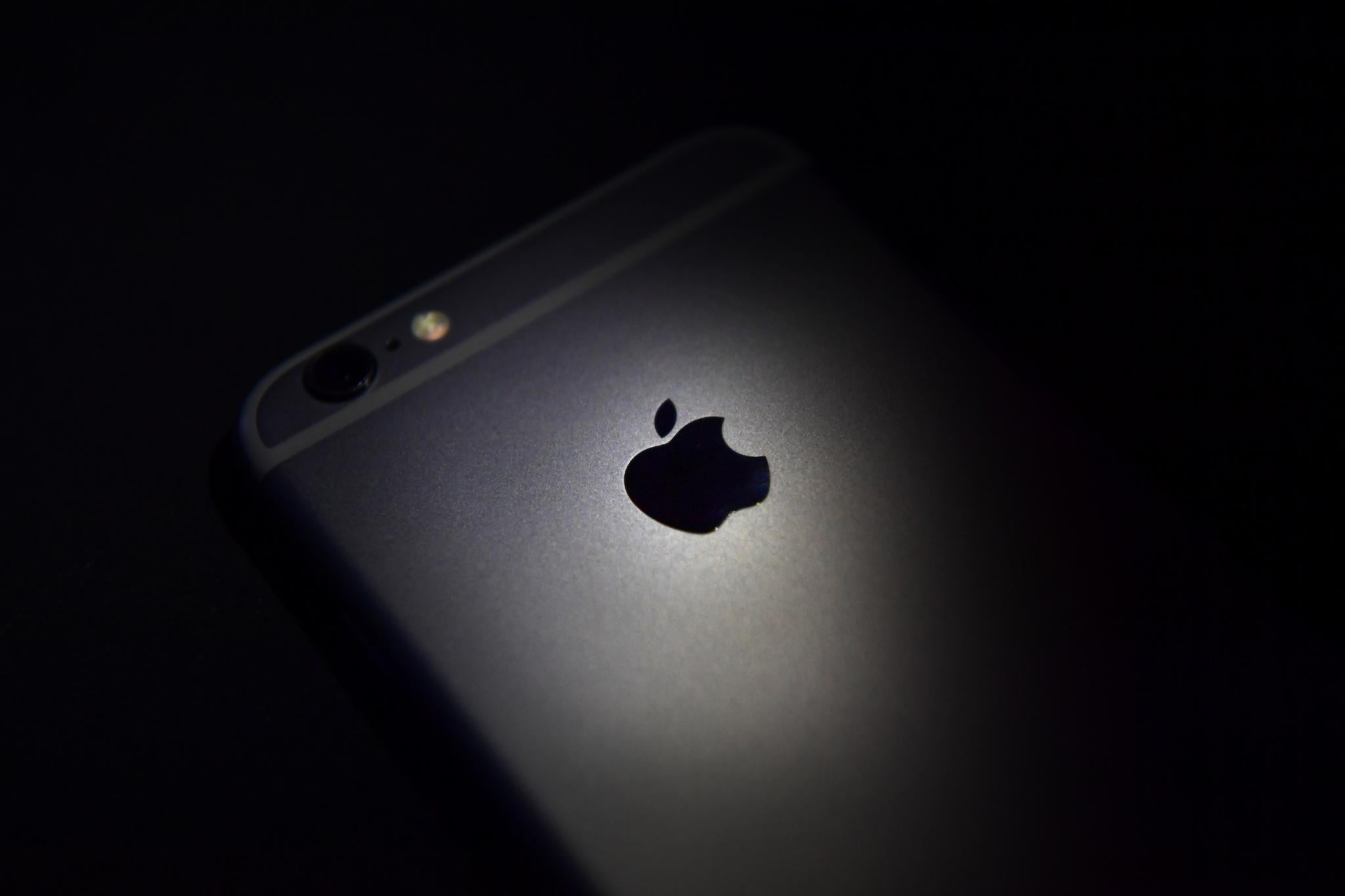 The Apple logo is displayed on the back of an iPhone on August 3, 2016 in London, England