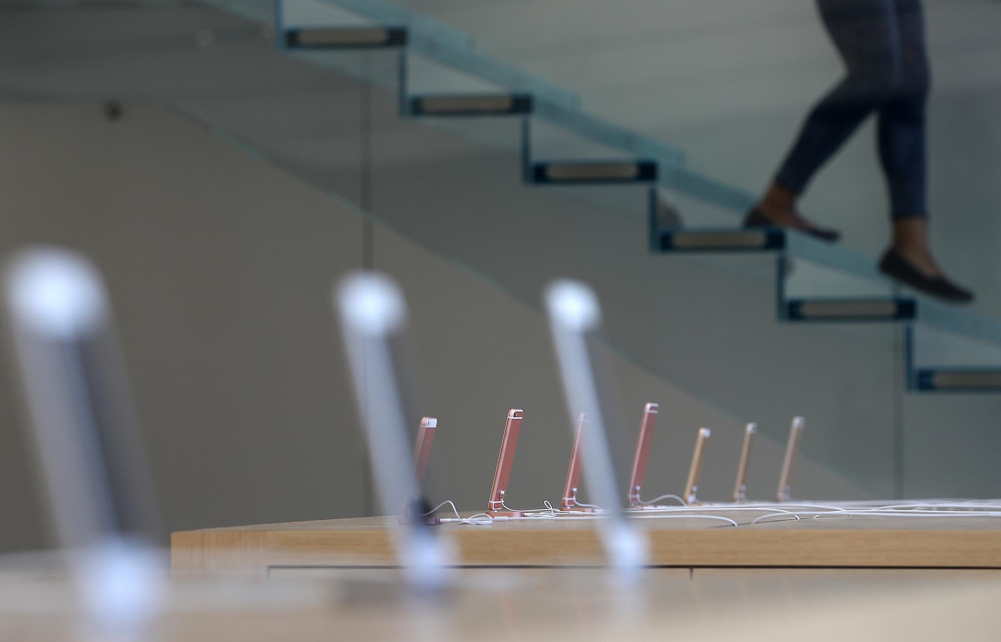 Apple iPhones are displayed during a press preview of the new flagship Apple Store on May 19, 2016 in San Francisco, California