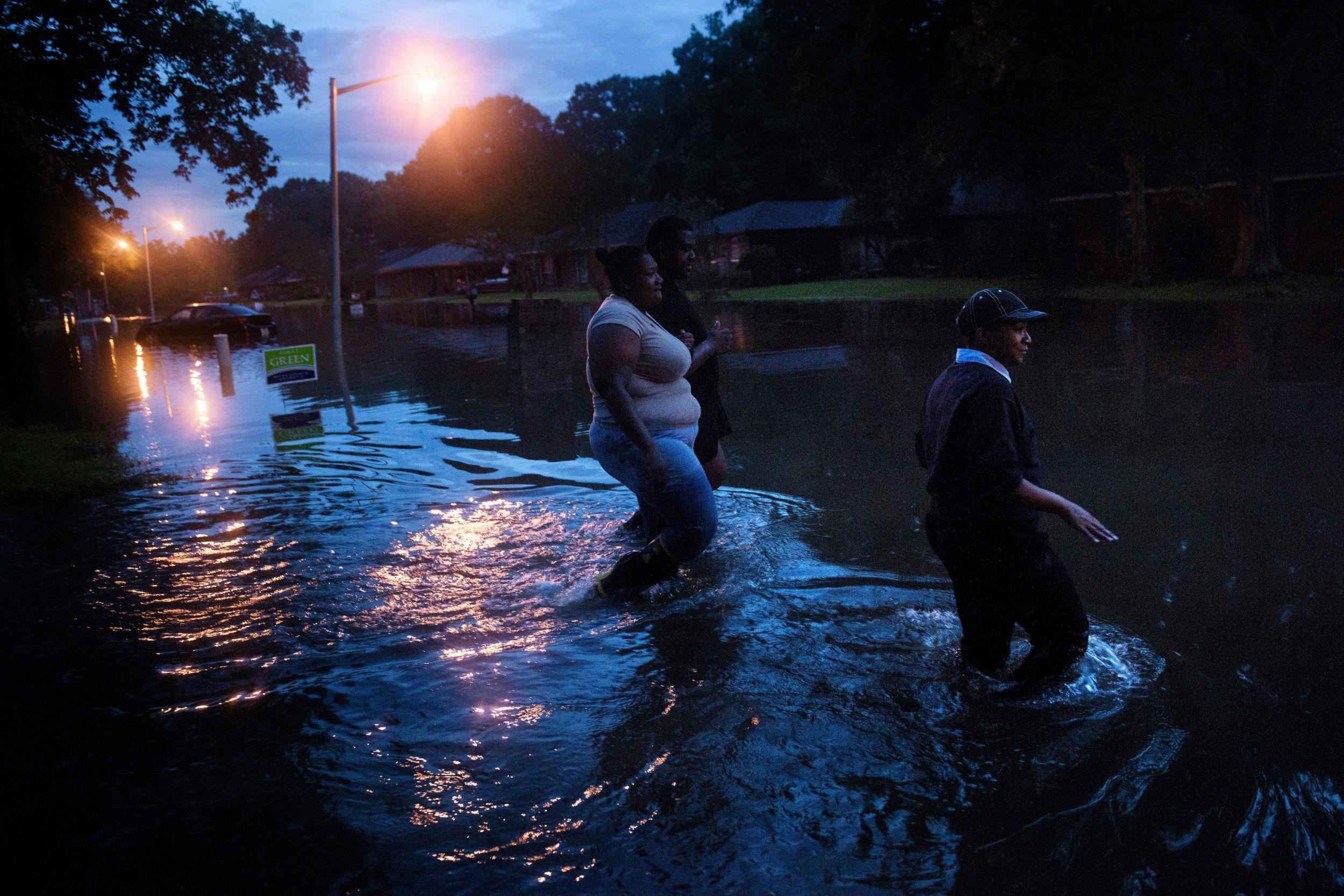 Residents venture out in their flooded neighbourhoods